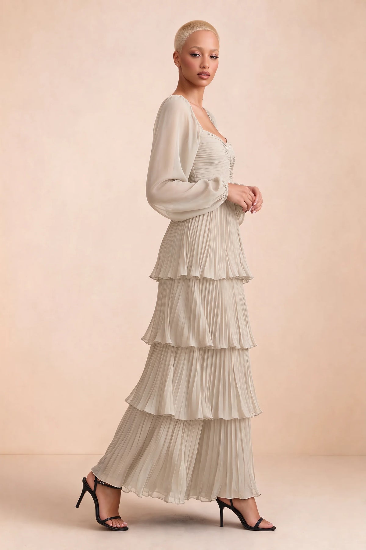 Alternate front studio view of Sienna cream tiered pleated maxi dress with a long flowing skirt