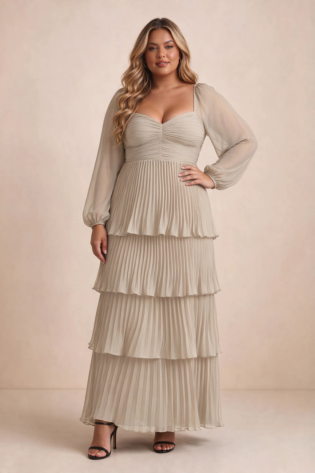 Front view on a second model of Sienna cream tiered pleated maxi dress with a long flowing skirt