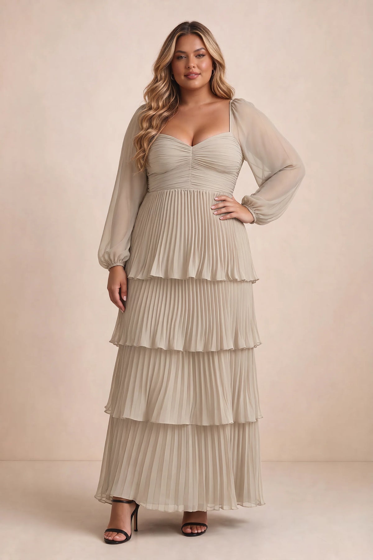 Front view on a second model of Sienna cream tiered pleated maxi dress with a long flowing skirt