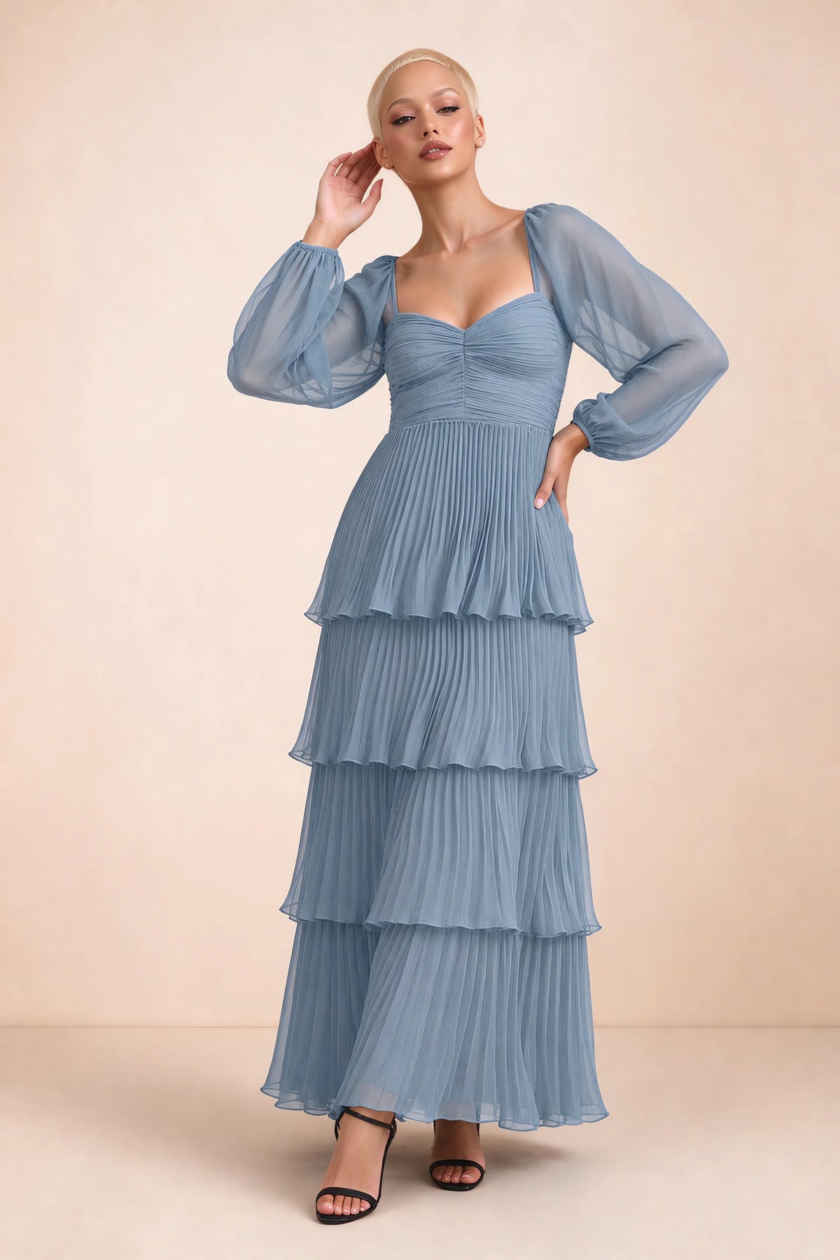 Front studio view of Sienna dusty blue tiered pleated maxi dress with a long flowing skirt