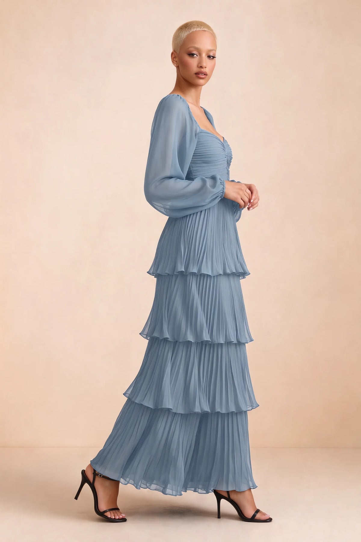 Alternate front studio view of Sienna dusty blue tiered pleated maxi dress with a long flowing skirt