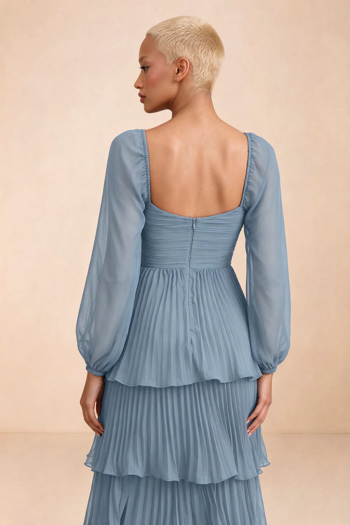Close-up of low square back, sheer sleeves and centre-back zipper of Sienna dusty blue tiered pleated maxi dress