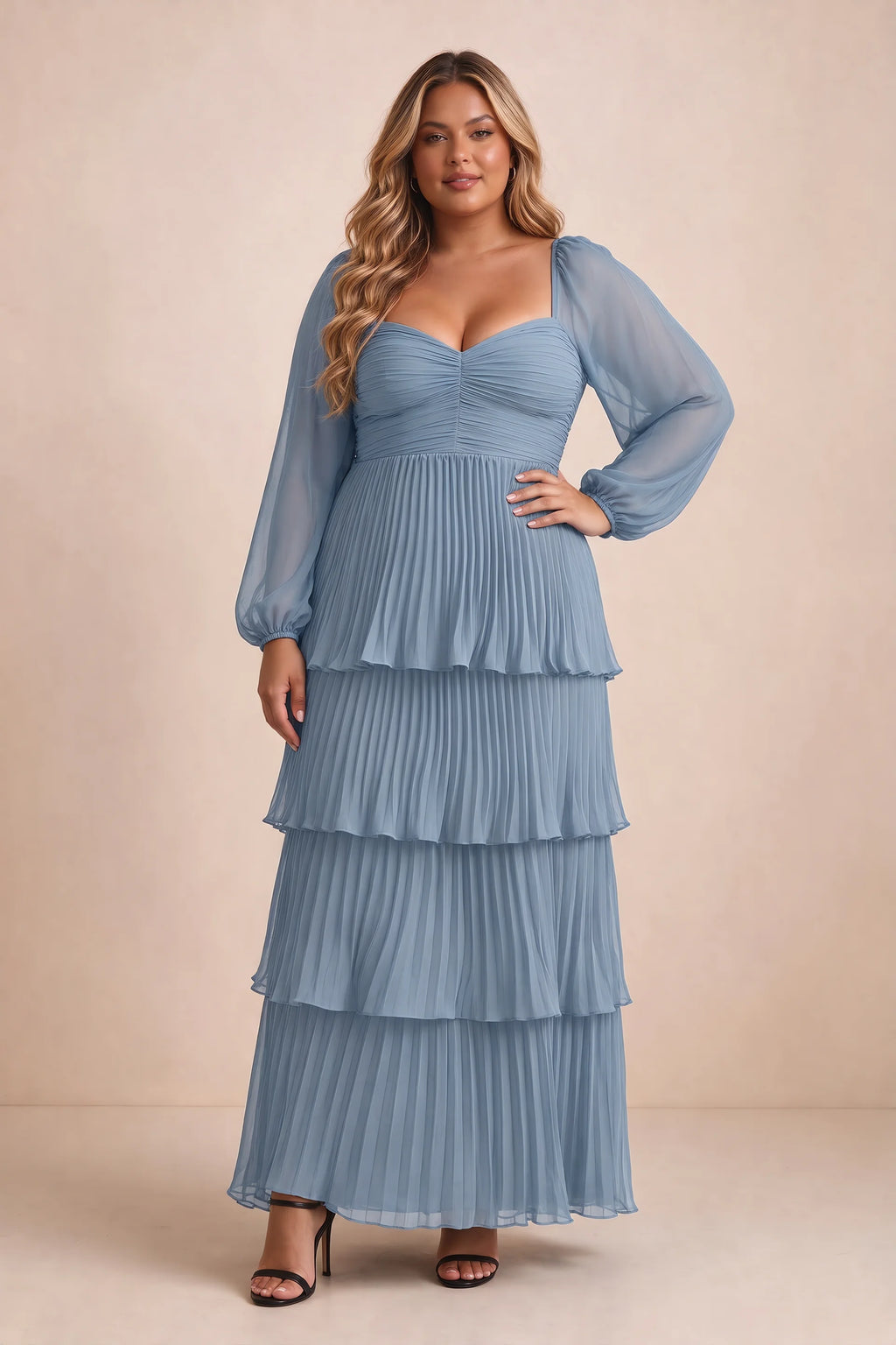 Front view on a second model of Sienna dusty blue tiered pleated maxi dress with a long flowing skirt
