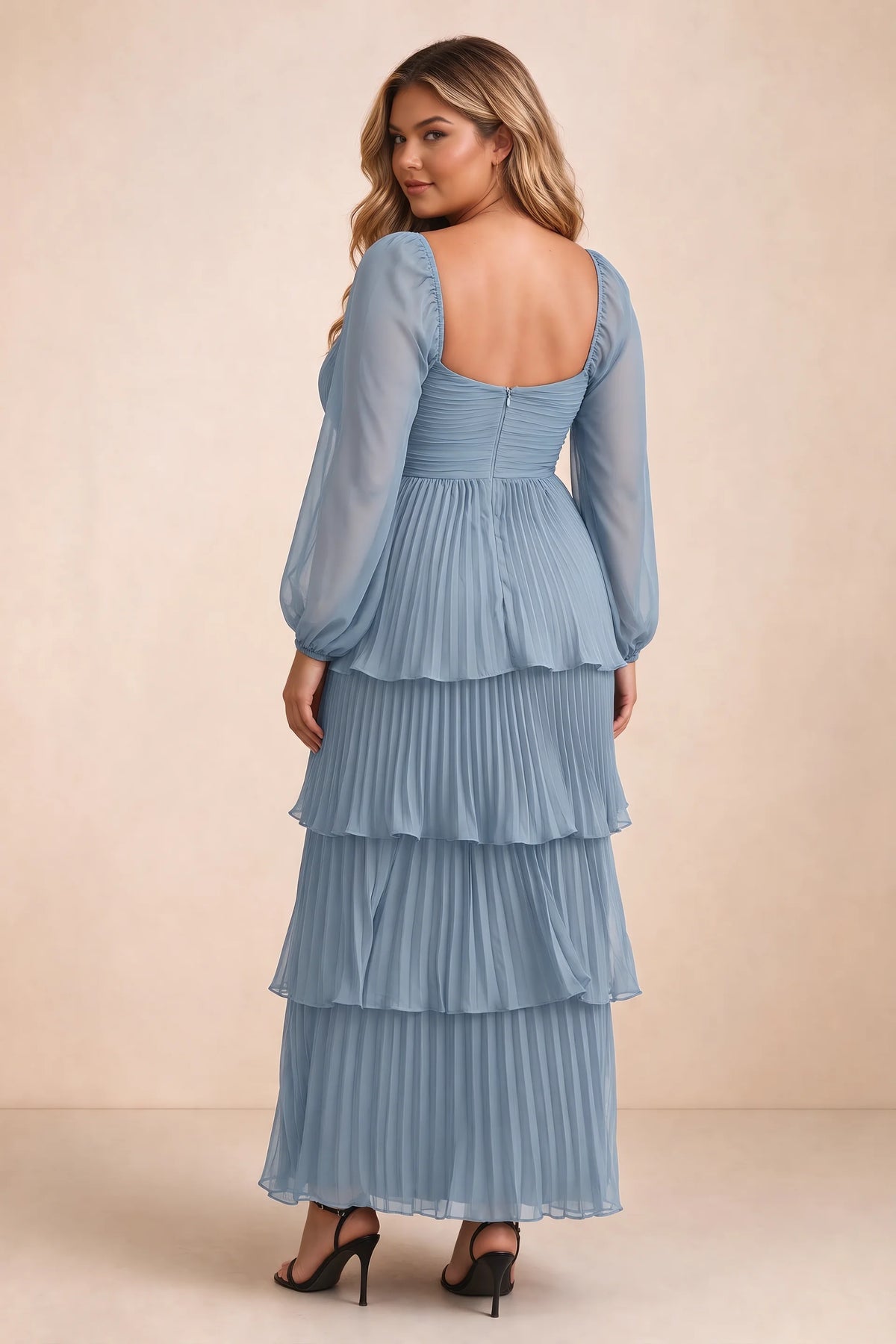 Rear view on a second model of Sienna dusty blue tiered pleated maxi dress with a long flowing skirt
