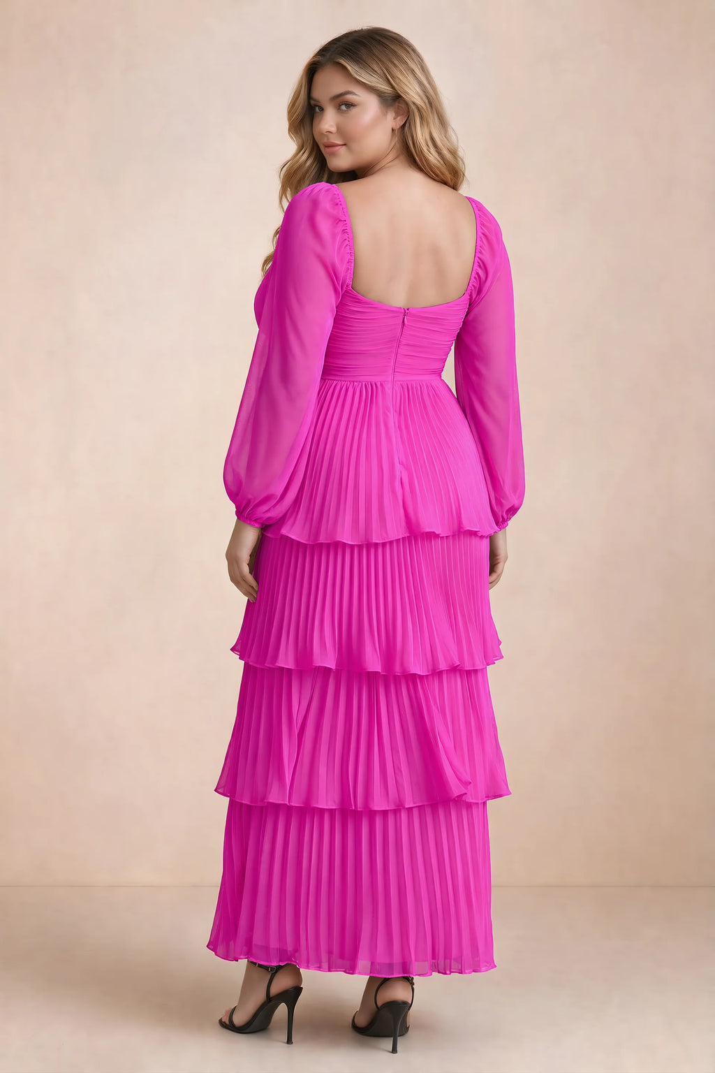 Rear view on a second model of Sienna fuchsia tiered pleated maxi dress with a long flowing skirt
