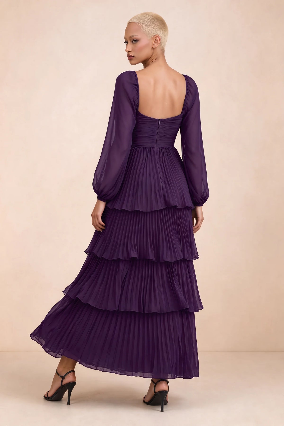 Rear studio view of Sienna grape tiered pleated maxi dress with a long flowing skirt