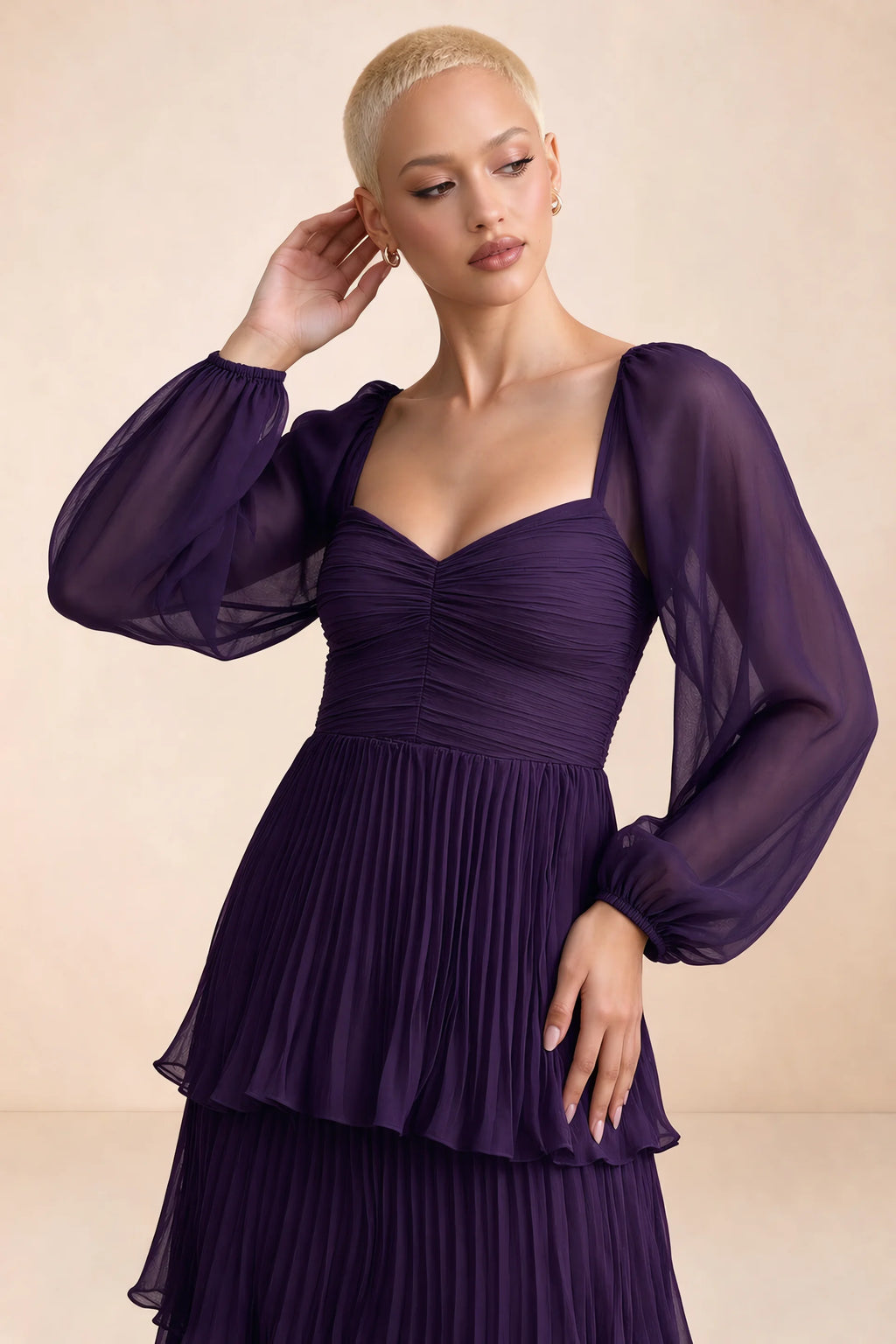 Close-up of sweetheart neckline, sheer sleeves and ruched waist of Sienna grape tiered pleated maxi dress
