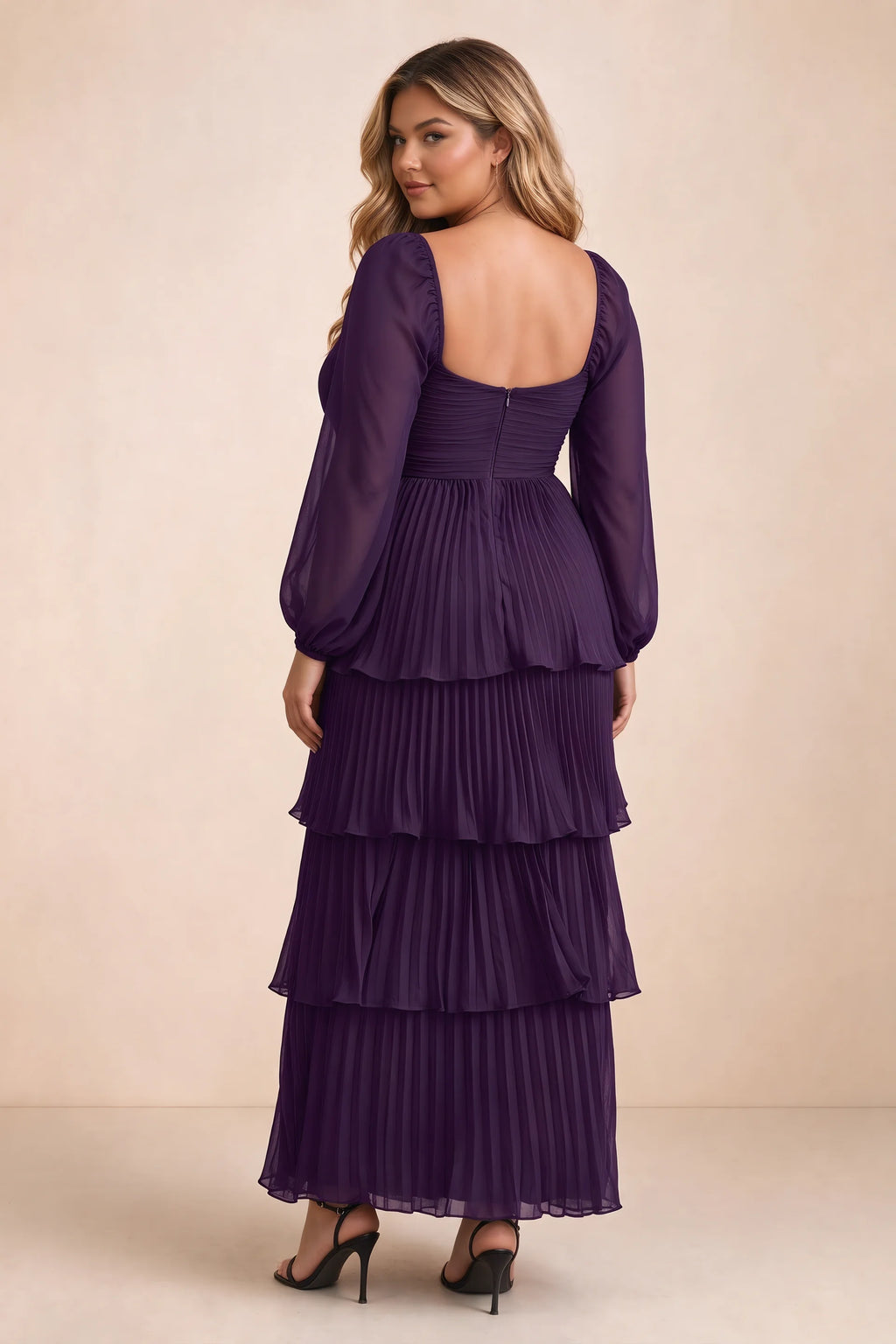Rear view on a second model of Sienna grape tiered pleated maxi dress with a long flowing skirt