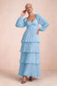 Front studio view of Sienna haze blue tiered pleated maxi dress with a long flowing skirt