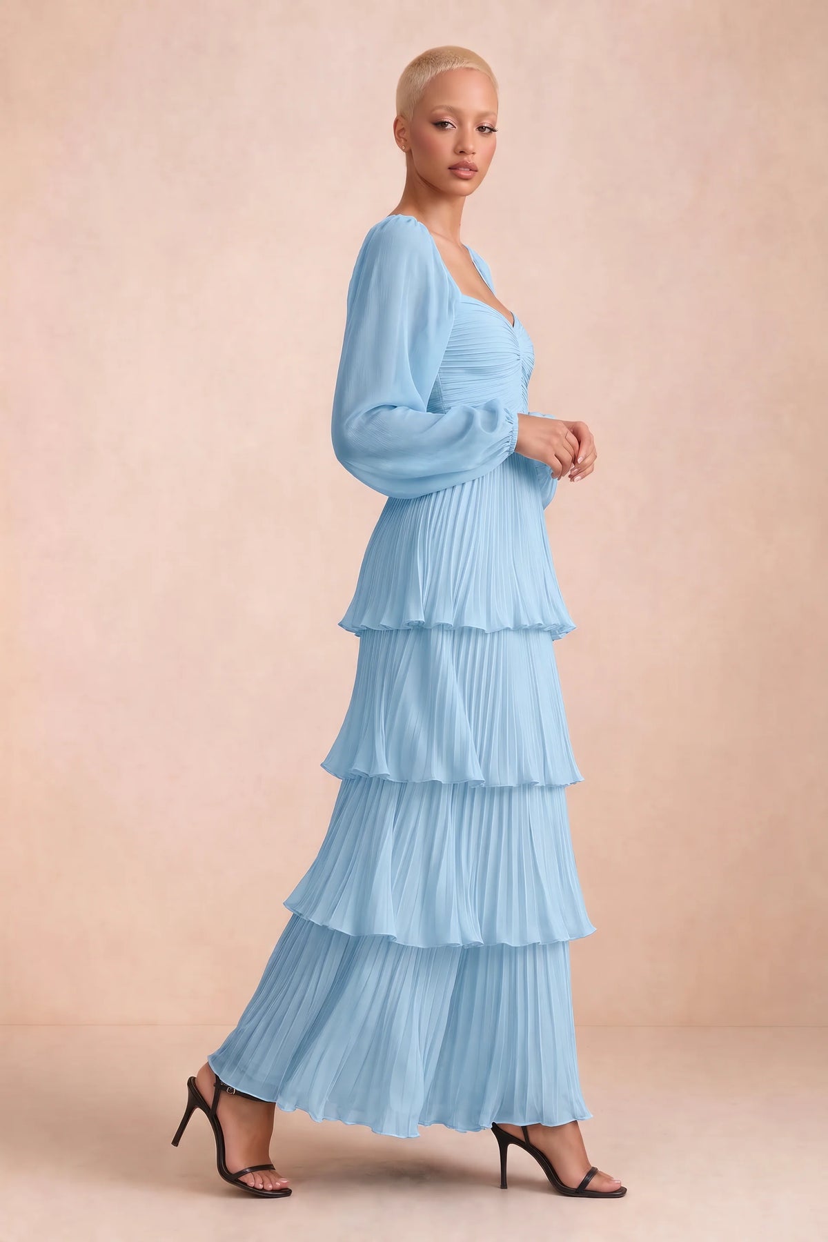 Alternate front studio view of Sienna haze blue tiered pleated maxi dress with a long flowing skirt