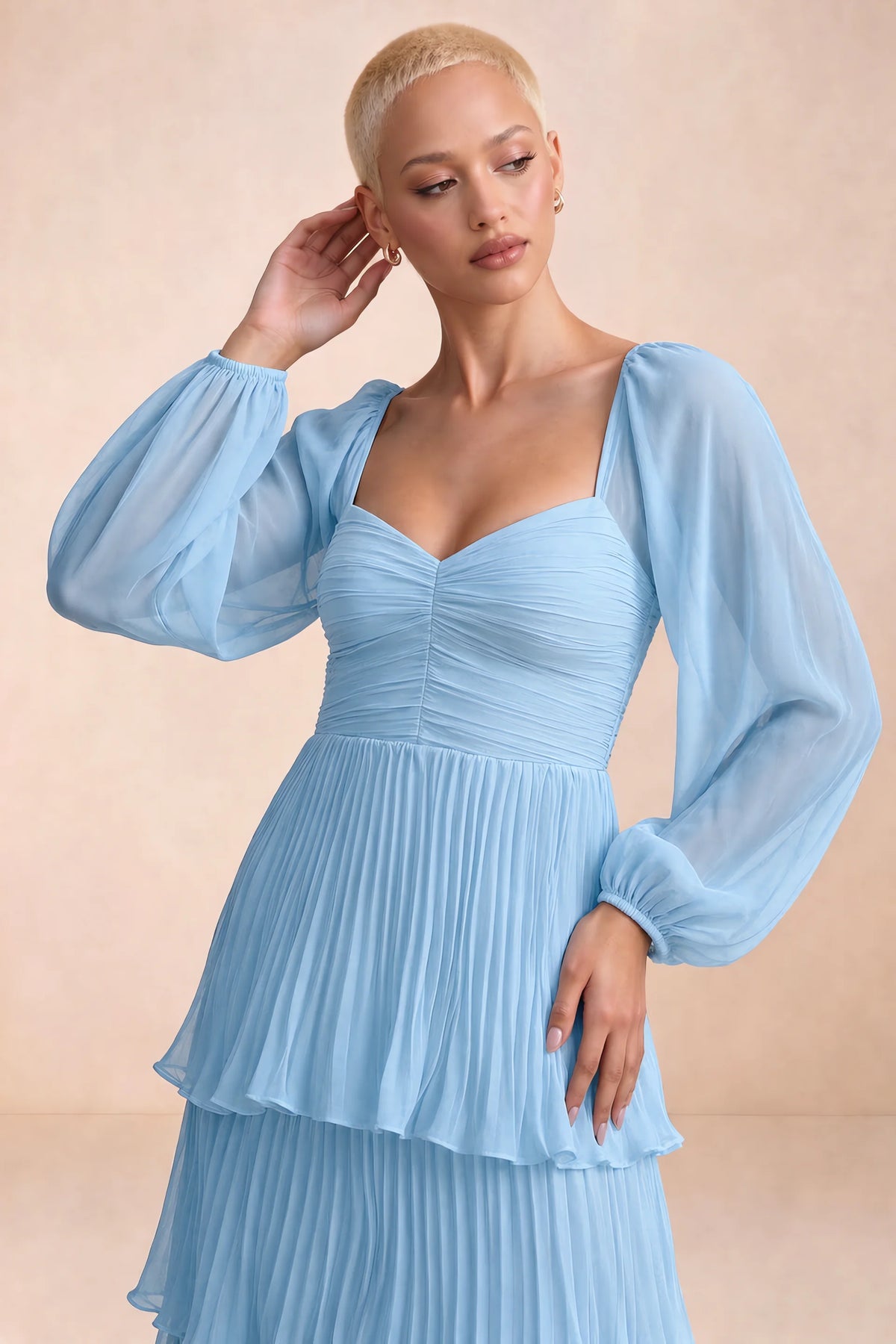 Close-up of sweetheart neckline, sheer sleeves and ruched waist of Sienna haze blue tiered pleated maxi dress