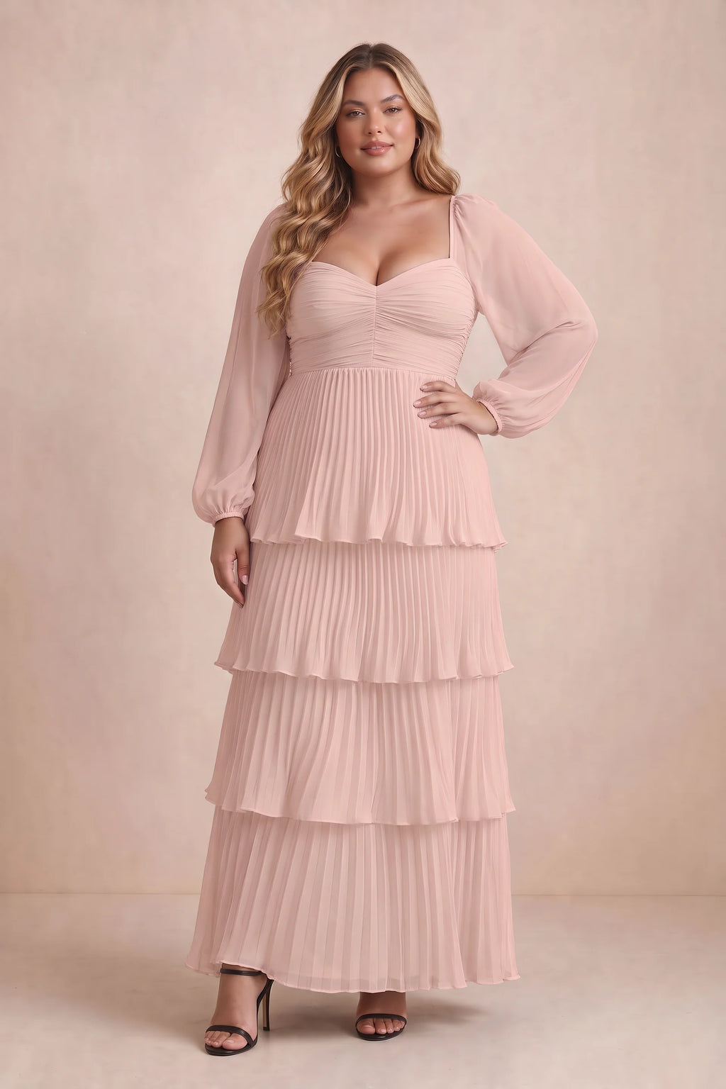 Front view on a second model of Sienna haze pink tiered pleated maxi dress with a long flowing skirt