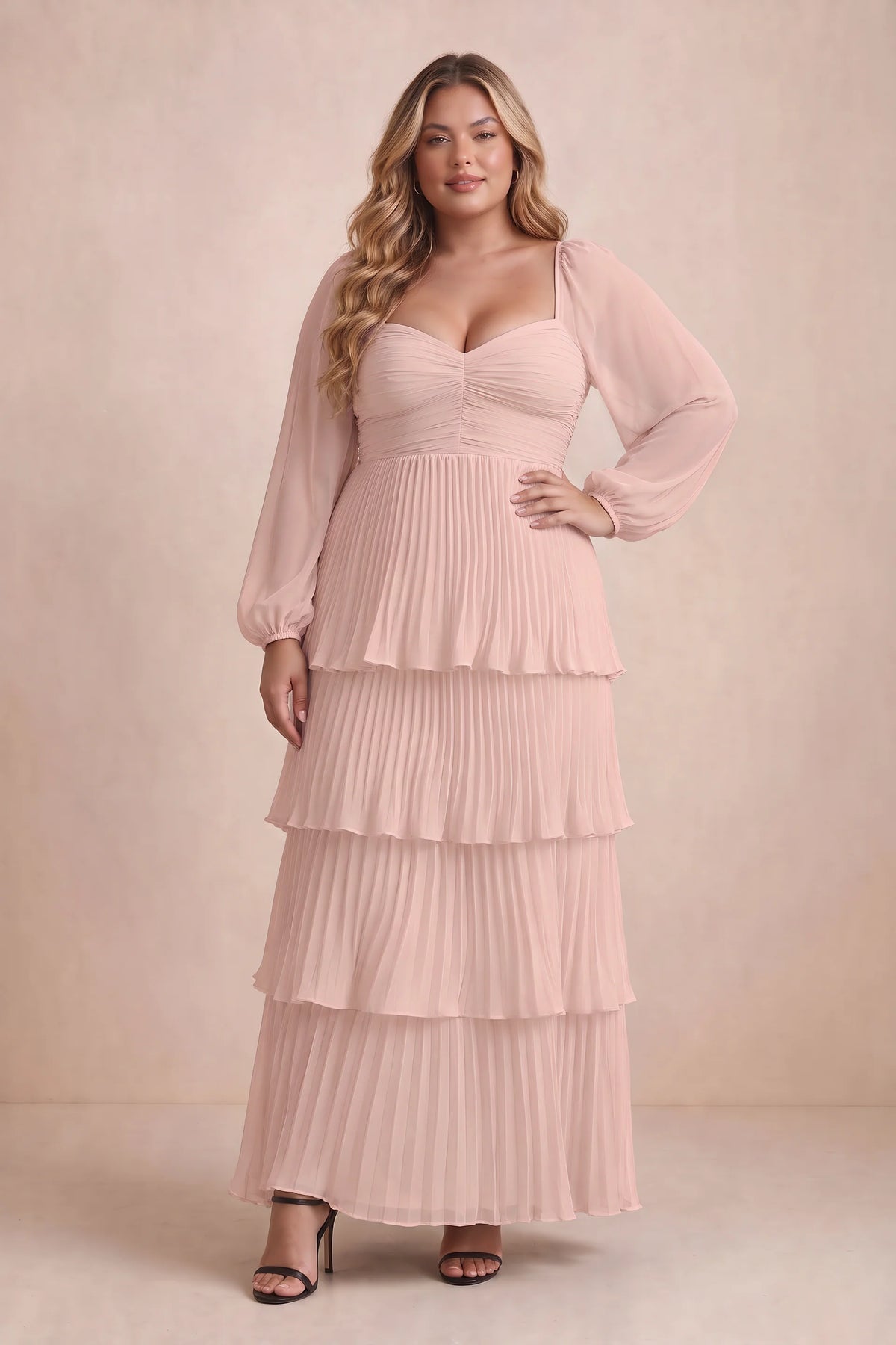 Front view on a second model of Sienna haze pink tiered pleated maxi dress with a long flowing skirt