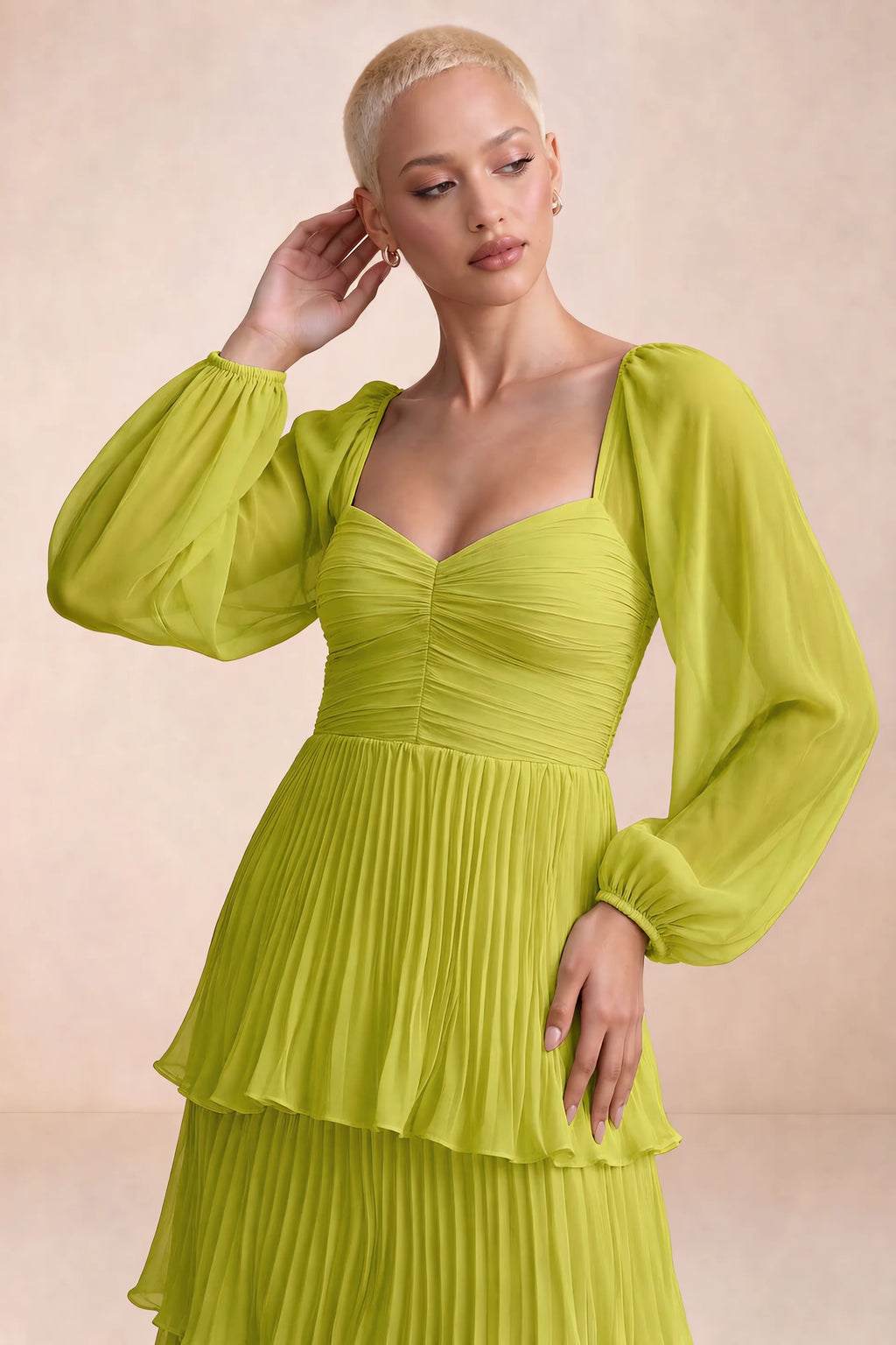Close-up of sweetheart neckline, sheer sleeves and ruched waist of Sienna lemon green tiered pleated maxi dress