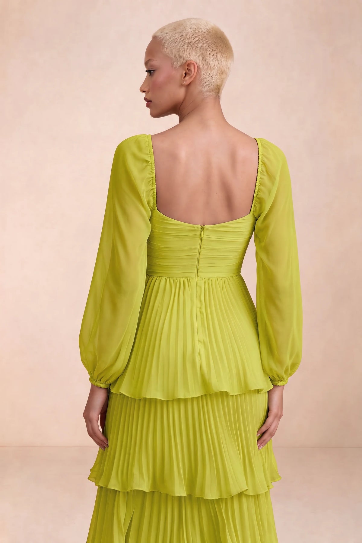 Close-up of low square back, sheer sleeves and centre-back zipper of Sienna lemon green tiered pleated maxi dress