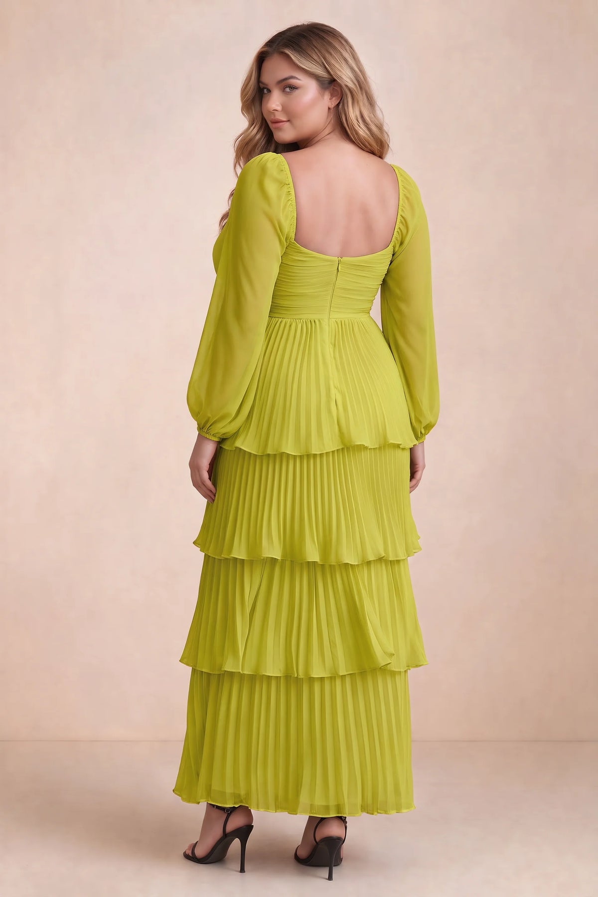 Rear view on a second model of Sienna lemon green tiered pleated maxi dress with a long flowing skirt