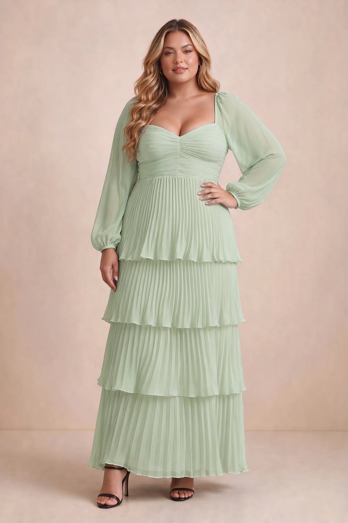 Front view on a second model of Sienna light green tiered pleated maxi dress with a long flowing skirt
