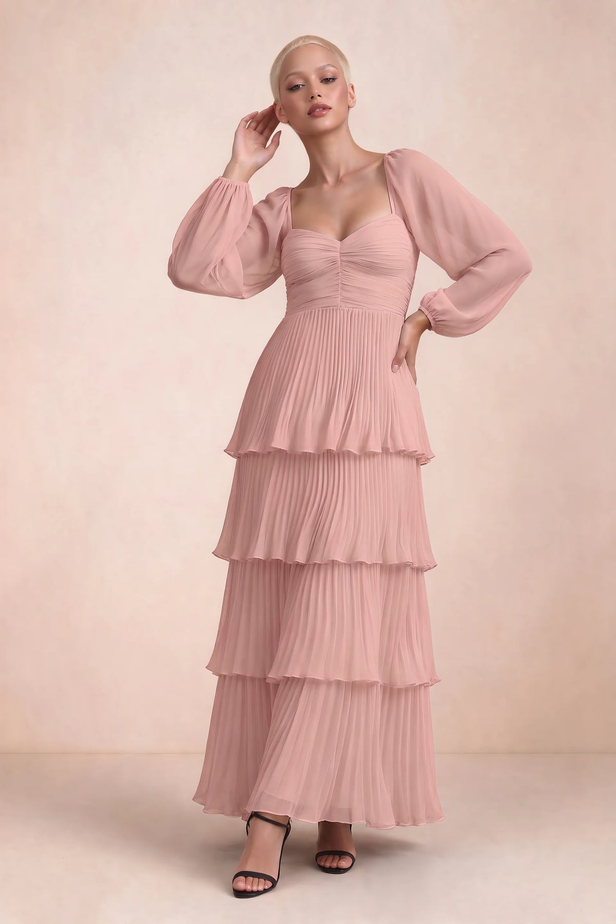 Front studio view of Sienna light pink tiered pleated maxi dress with a long flowing skirt