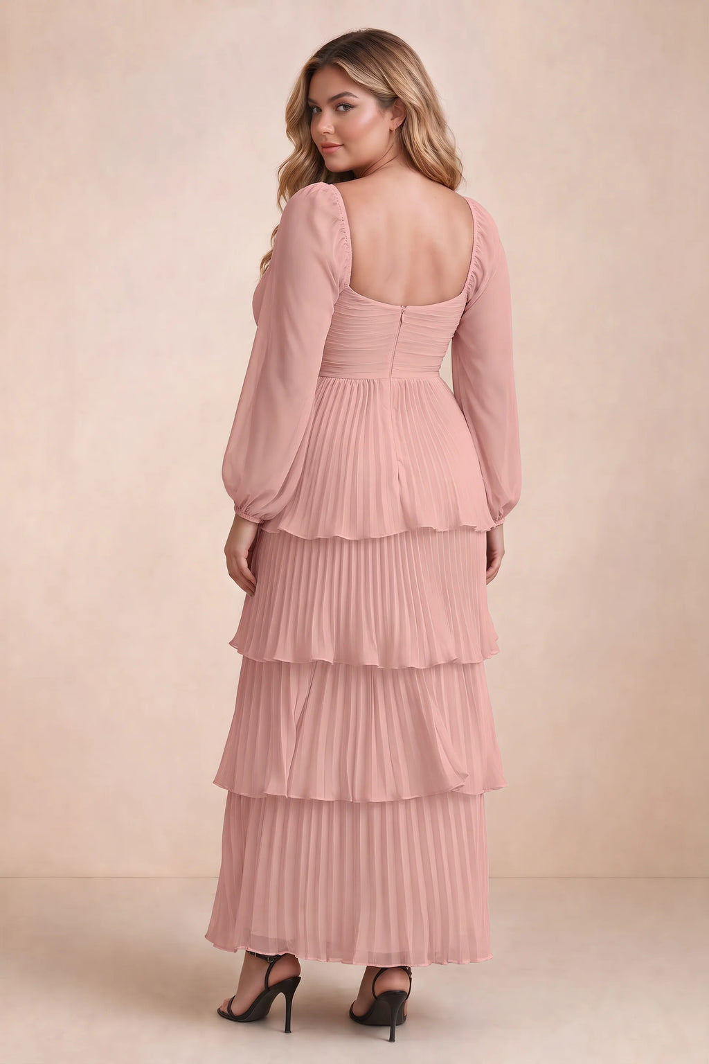 Rear view on a second model of Sienna light pink tiered pleated maxi dress with a long flowing skirt