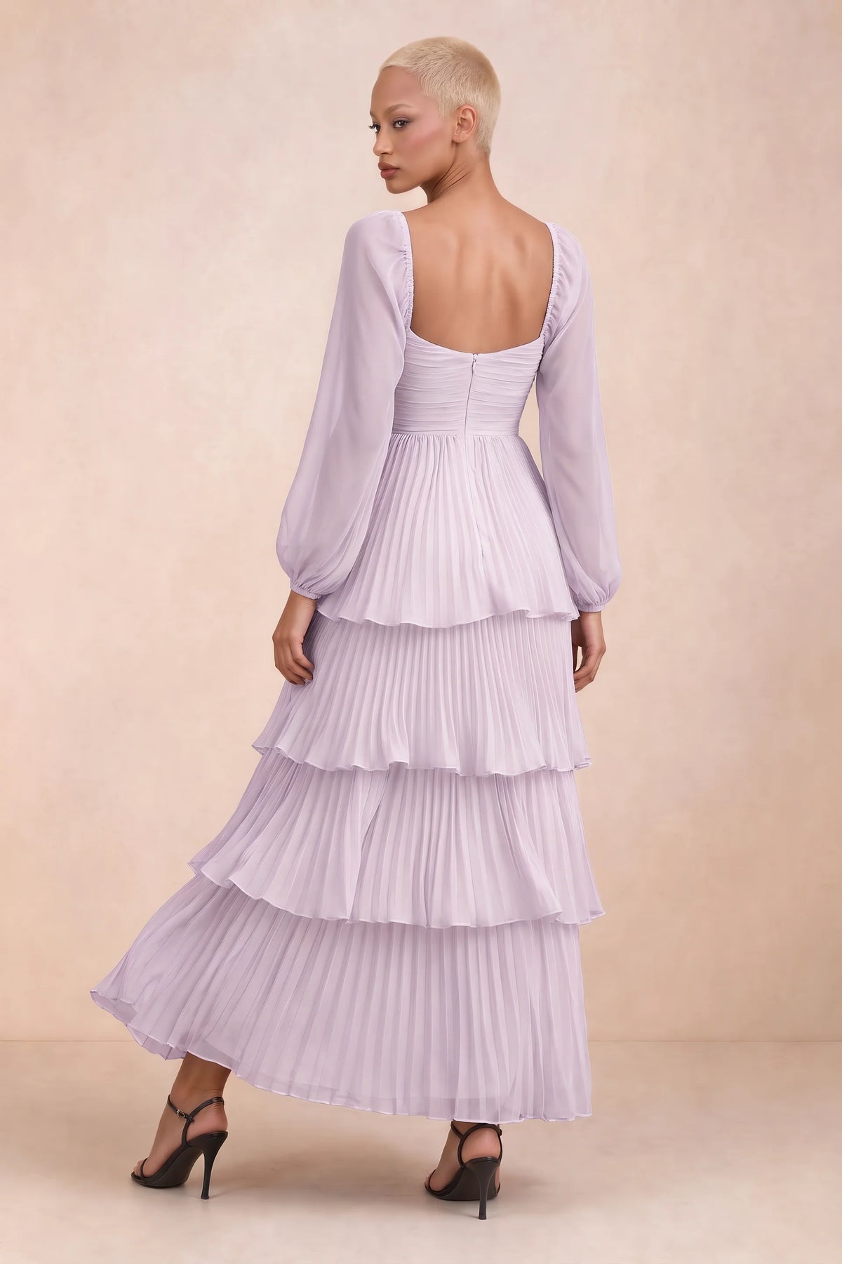 Rear studio view of Sienna lilac tiered pleated maxi dress with a long flowing skirt