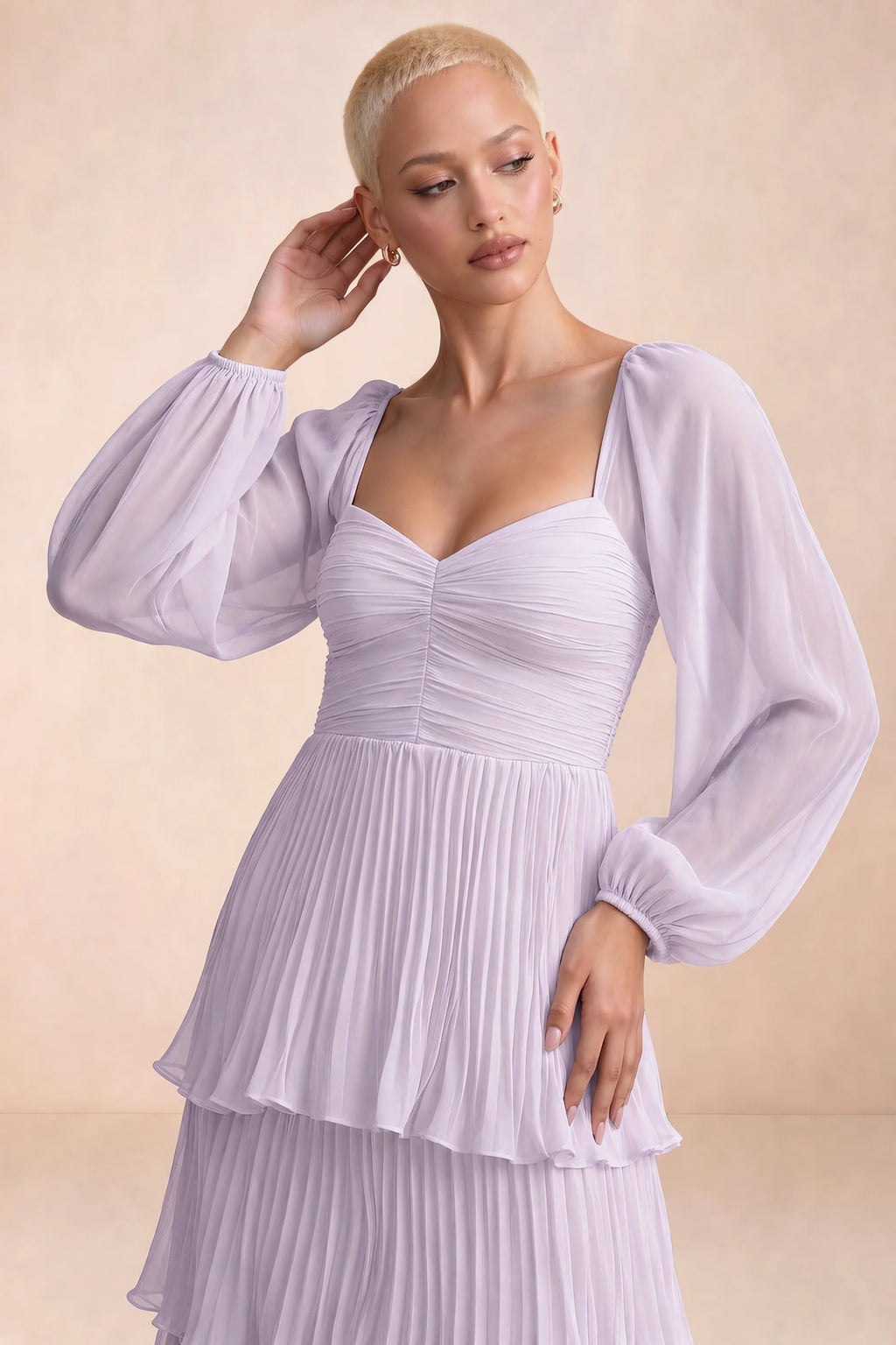 Close-up of sweetheart neckline, sheer sleeves and ruched waist of Sienna lilac tiered pleated maxi dress