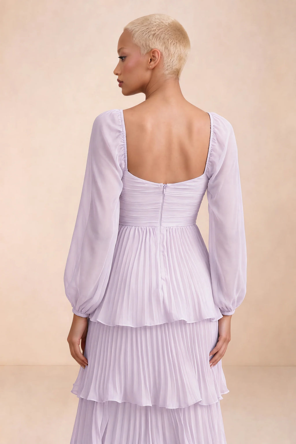 Close-up of low square back, sheer sleeves and centre-back zipper of Sienna lilac tiered pleated maxi dress