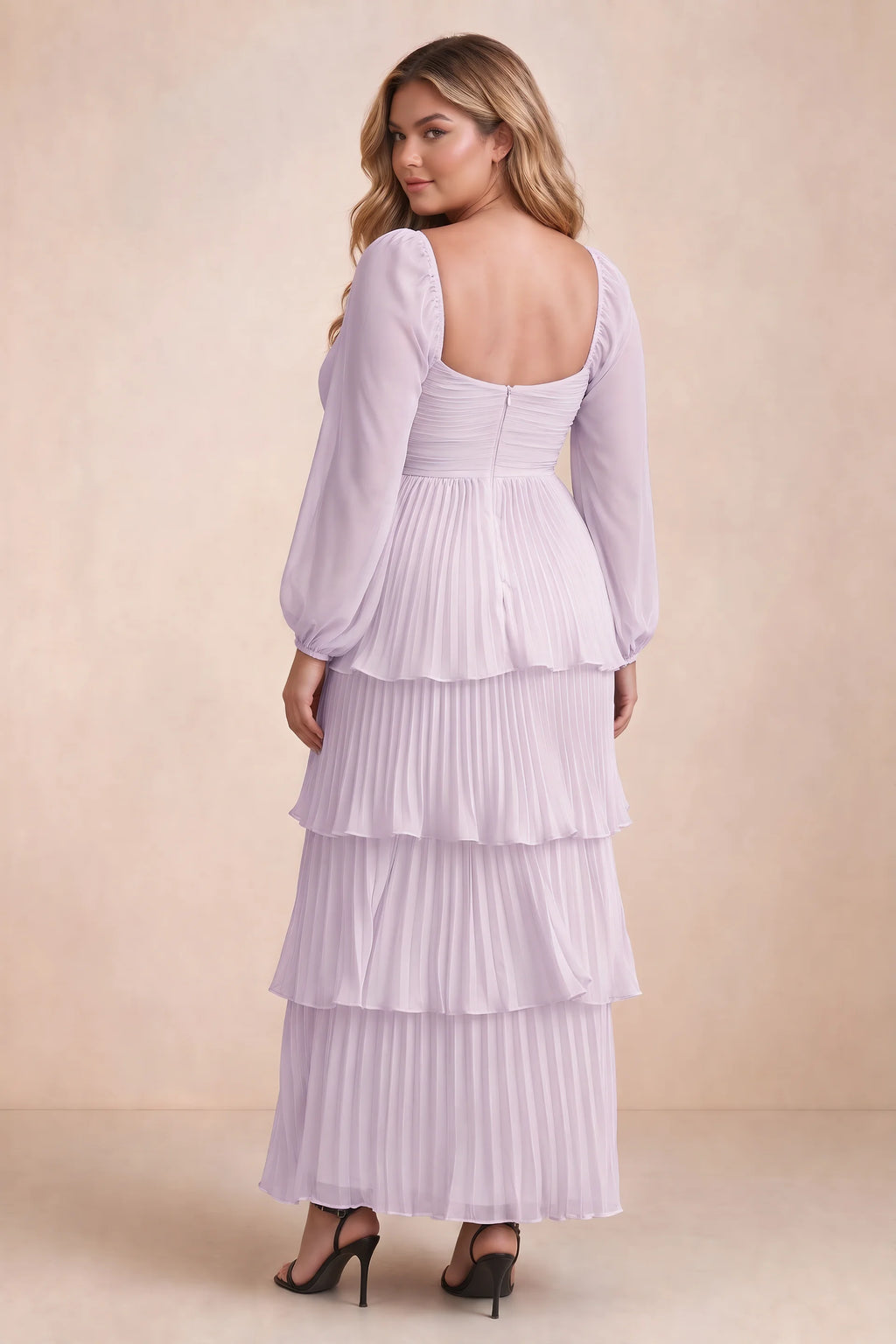 Rear view on a second model of Sienna lilac tiered pleated maxi dress with a long flowing skirt