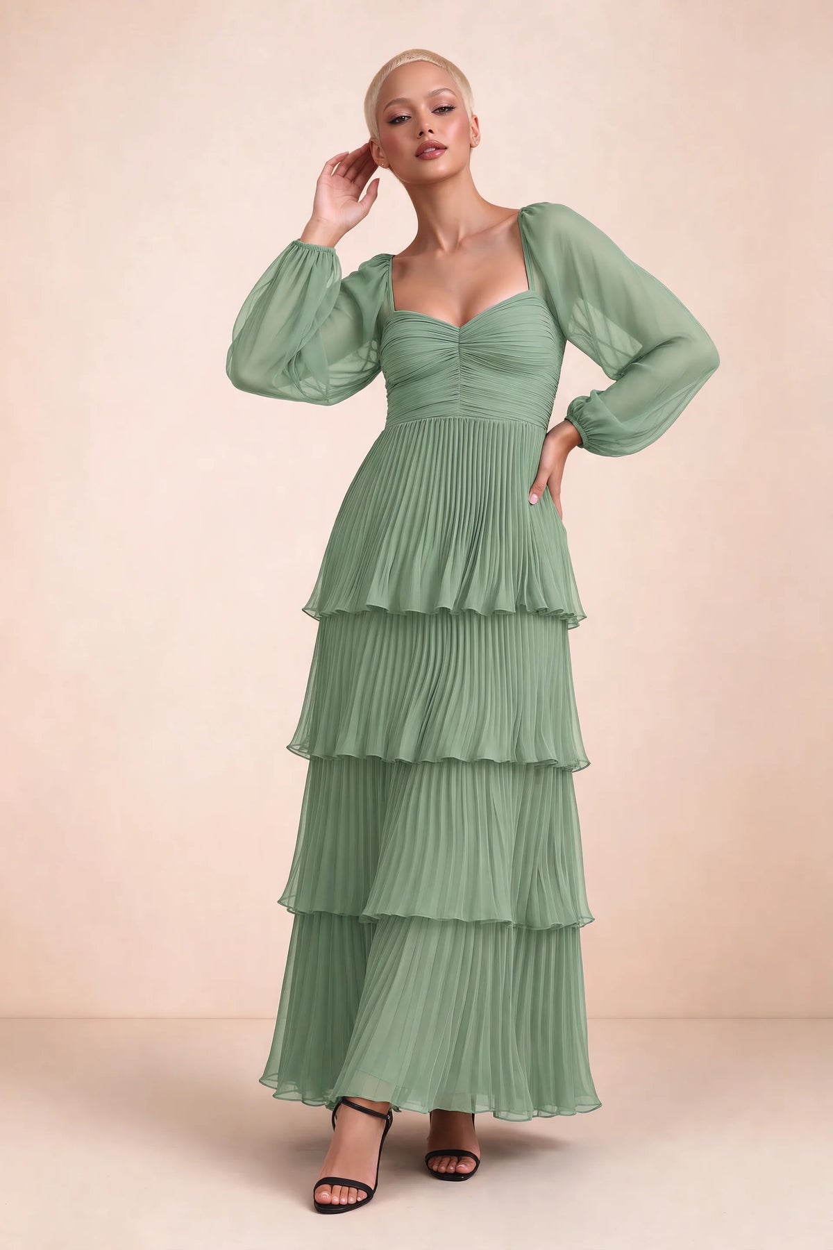 Front studio view of Sienna matcha green tiered pleated maxi dress with a long flowing skirt