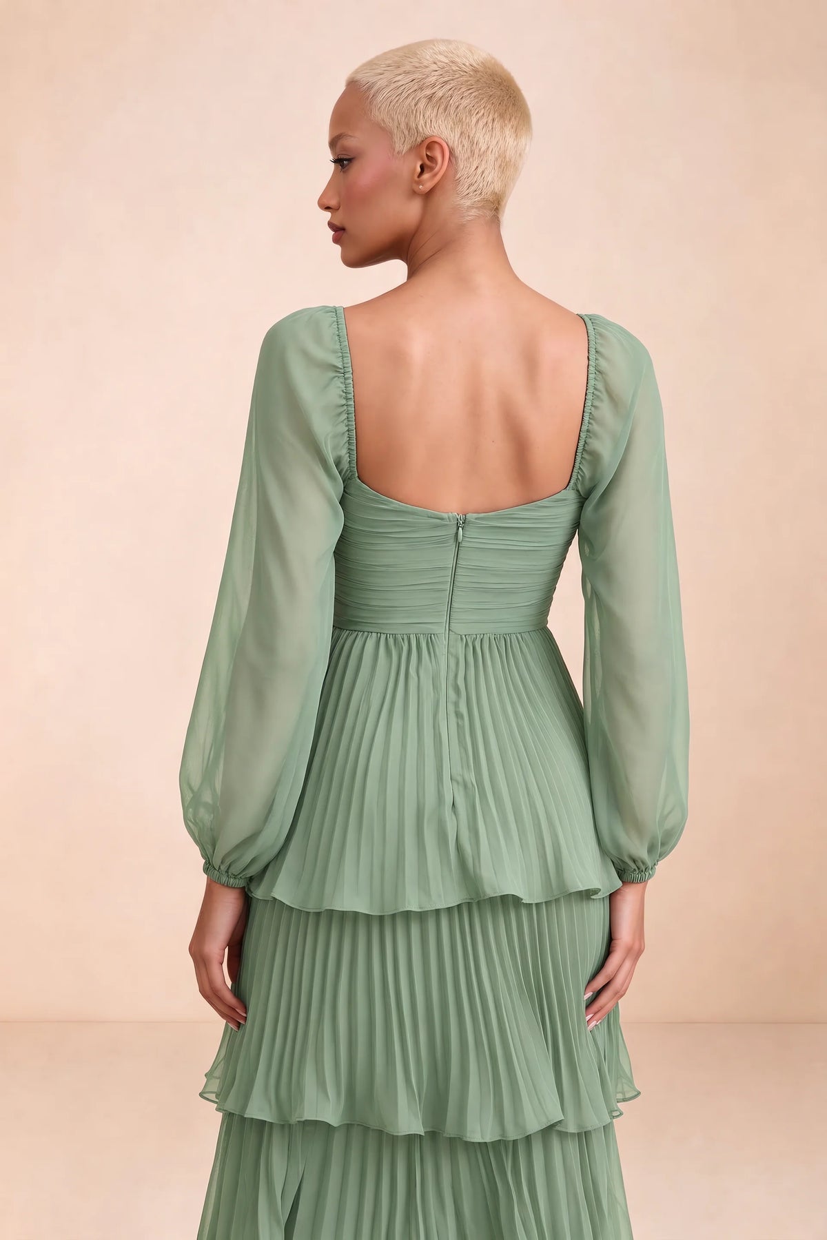 Close-up of low square back, sheer sleeves and centre-back zipper of Sienna matcha green tiered pleated maxi dress
