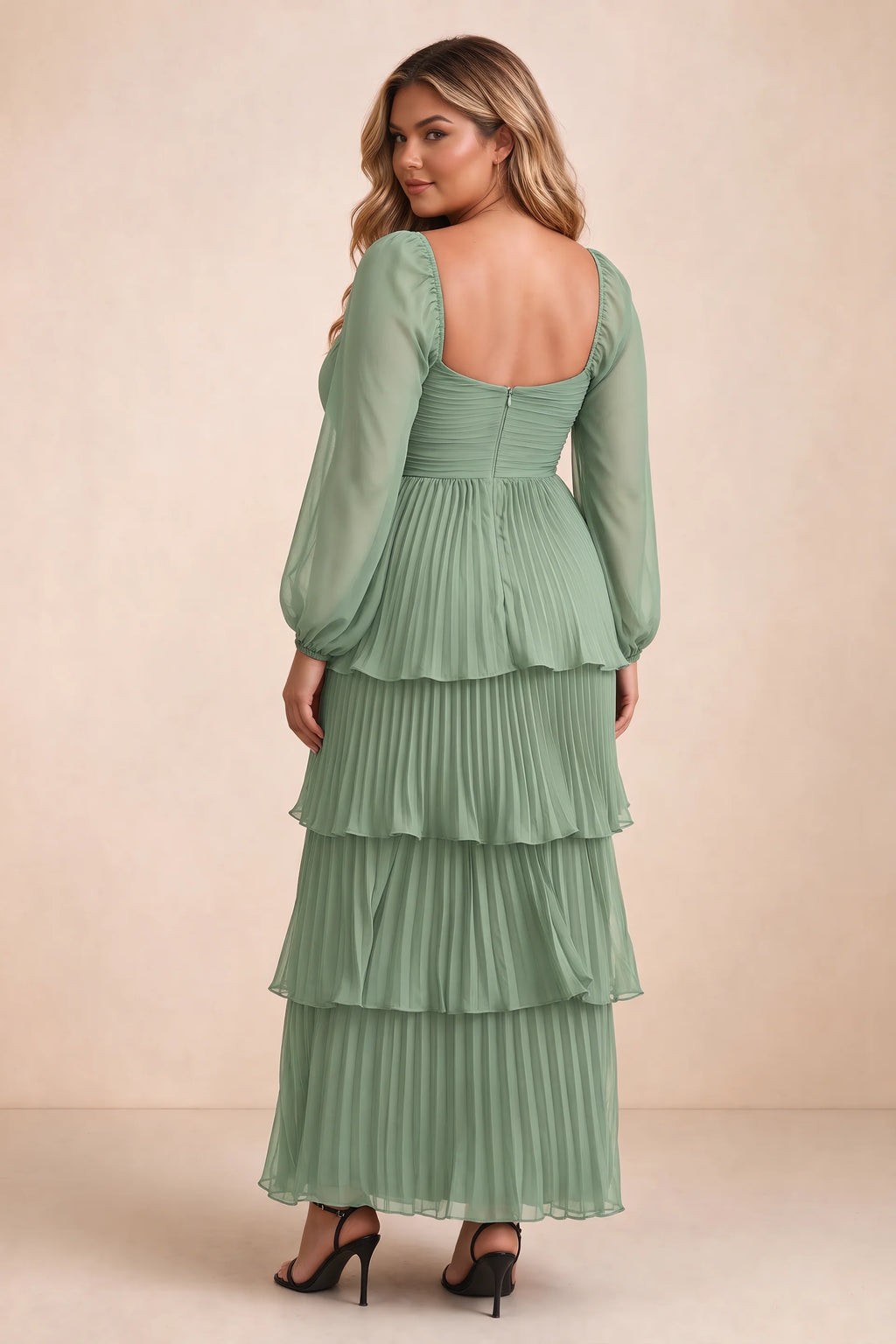 Rear view on a second model of Sienna matcha green tiered pleated maxi dress with a long flowing skirt