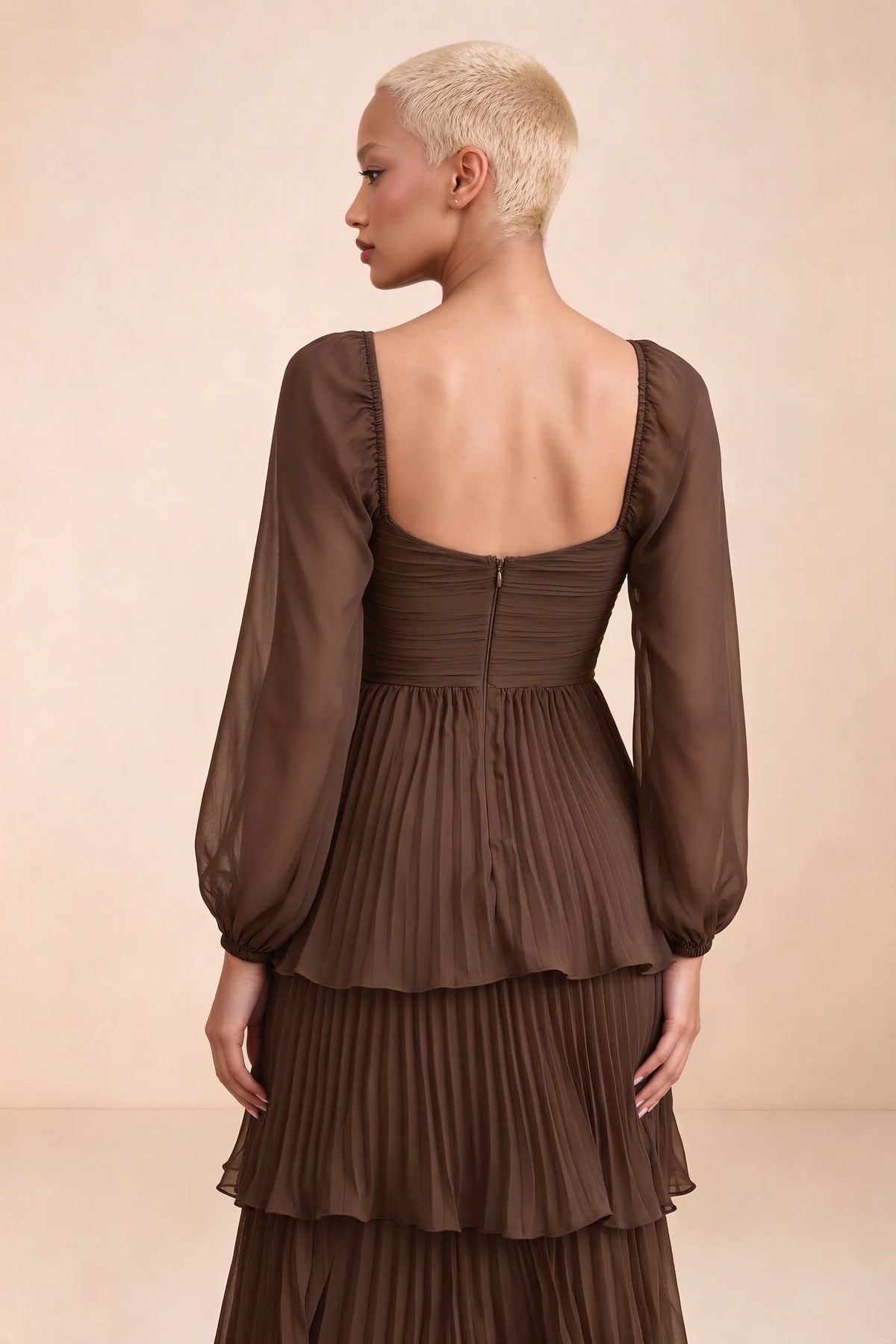 Close-up of low square back, sheer sleeves and centre-back zipper of Sienna mocha tiered pleated maxi dress