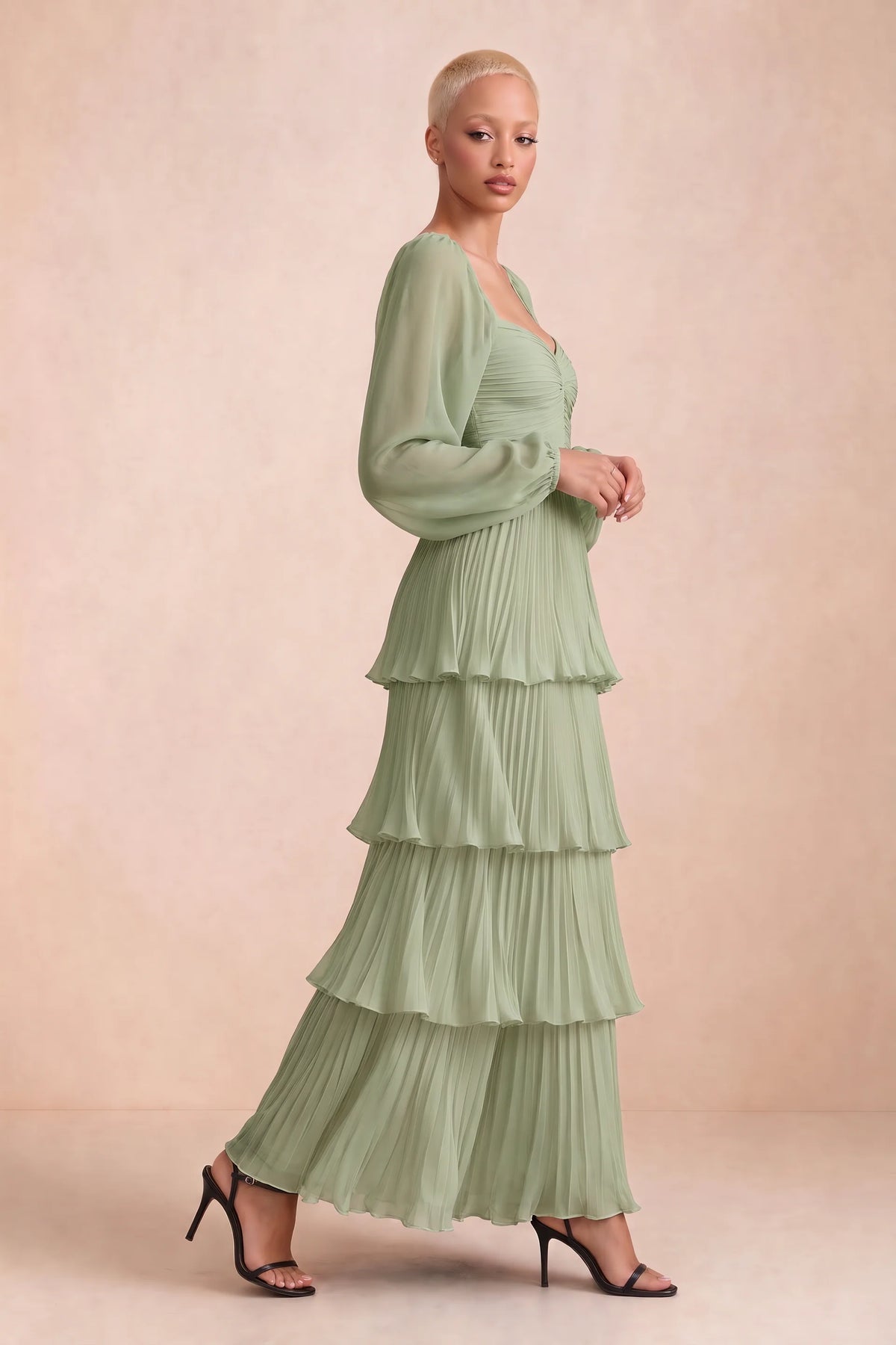 Alternate front studio view of Sienna pistachio tiered pleated maxi dress with a long flowing skirt