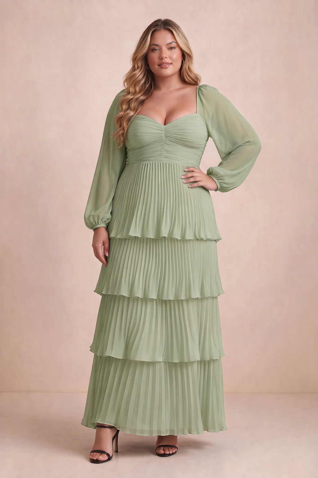 Front view on a second model of Sienna pistachio tiered pleated maxi dress with a long flowing skirt