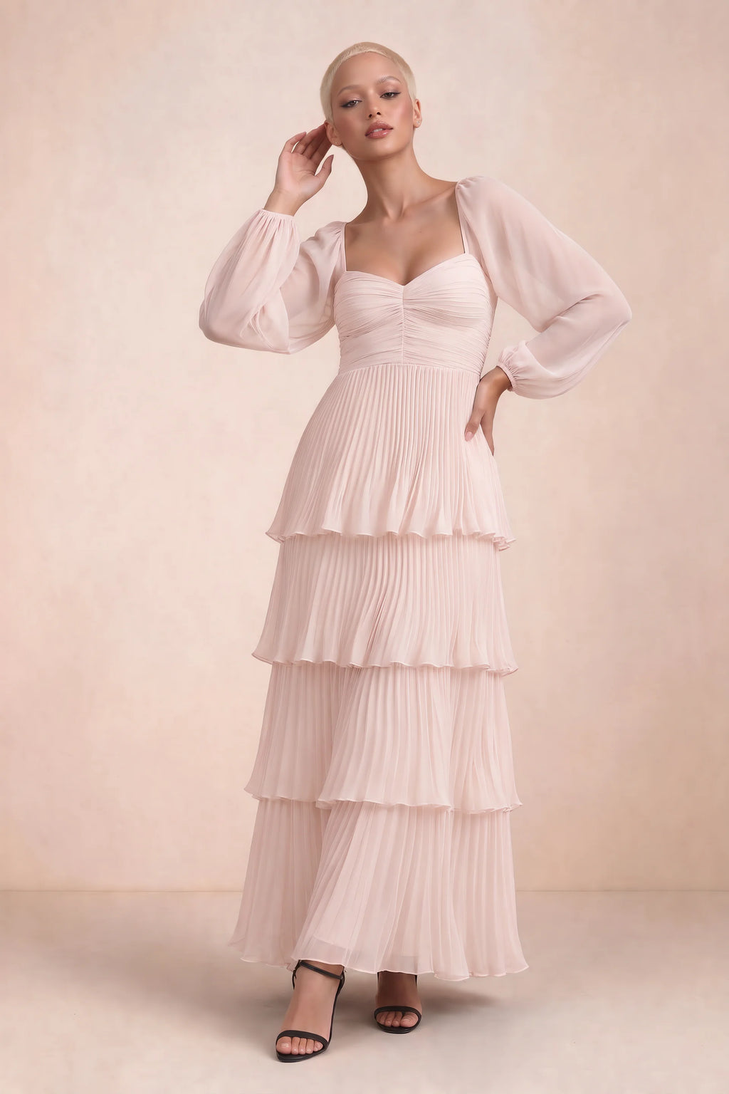 Front studio view of Sienna powder pink tiered pleated maxi dress with a long flowing skirt