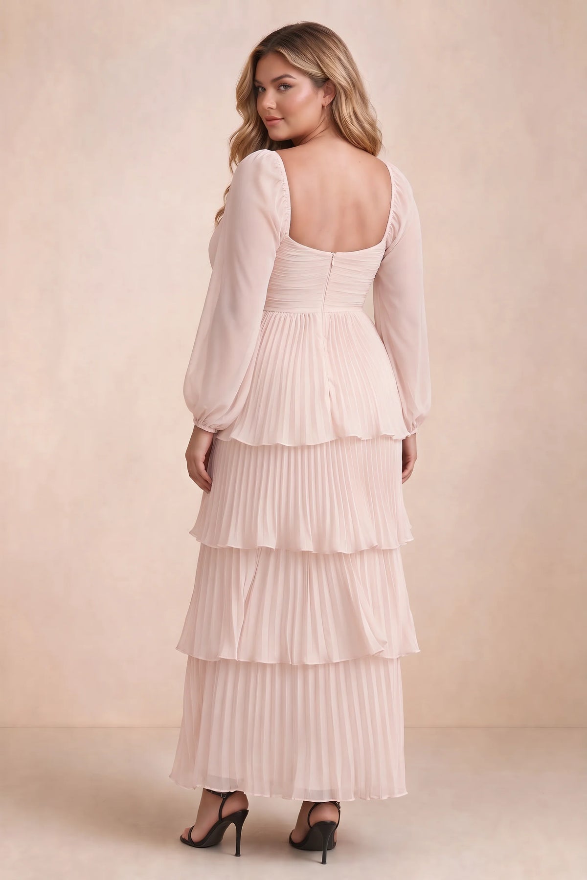 Rear view on a second model of Sienna powder pink tiered pleated maxi dress with a long flowing skirt