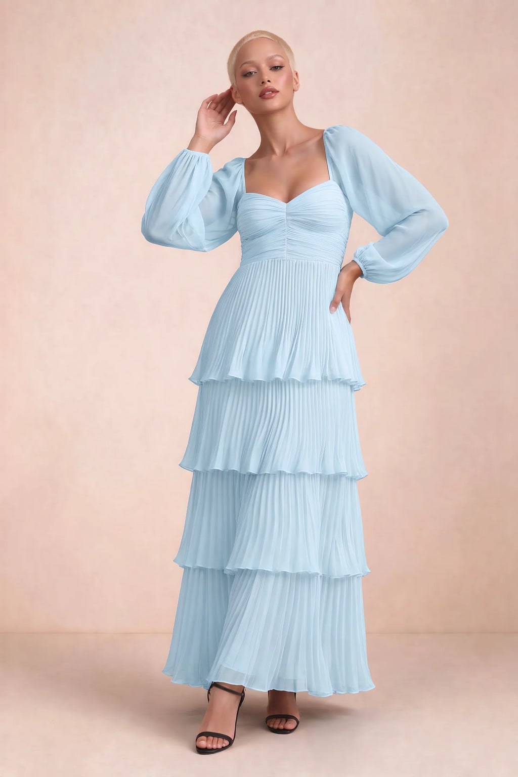 Front studio view of Sienna sky blue tiered pleated maxi dress with a long flowing skirt