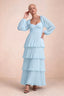 Front studio view of Sienna sky blue tiered pleated maxi dress with a long flowing skirt