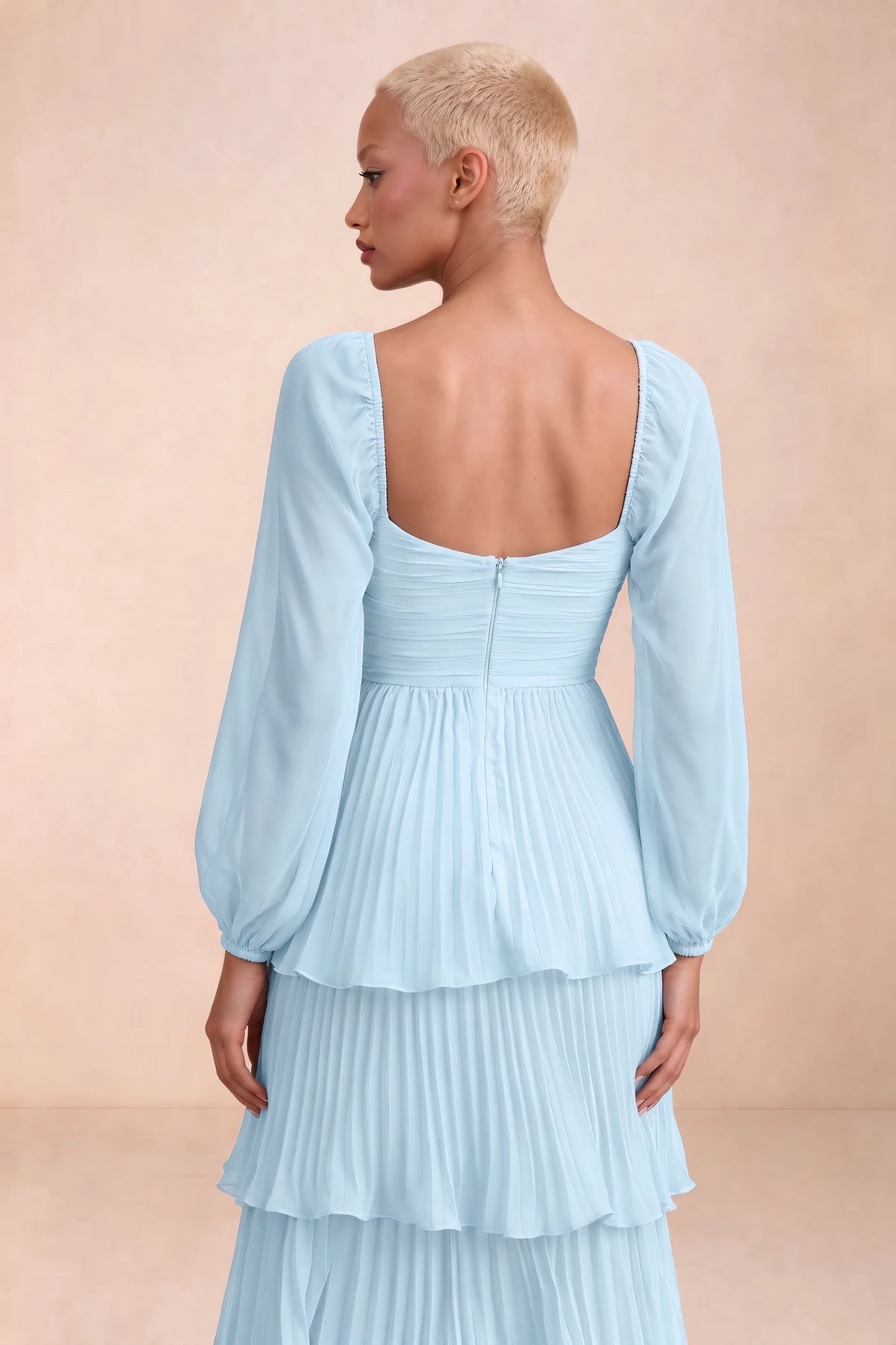 Close-up of low square back, sheer sleeves and centre-back zipper of Sienna sky blue tiered pleated maxi dress