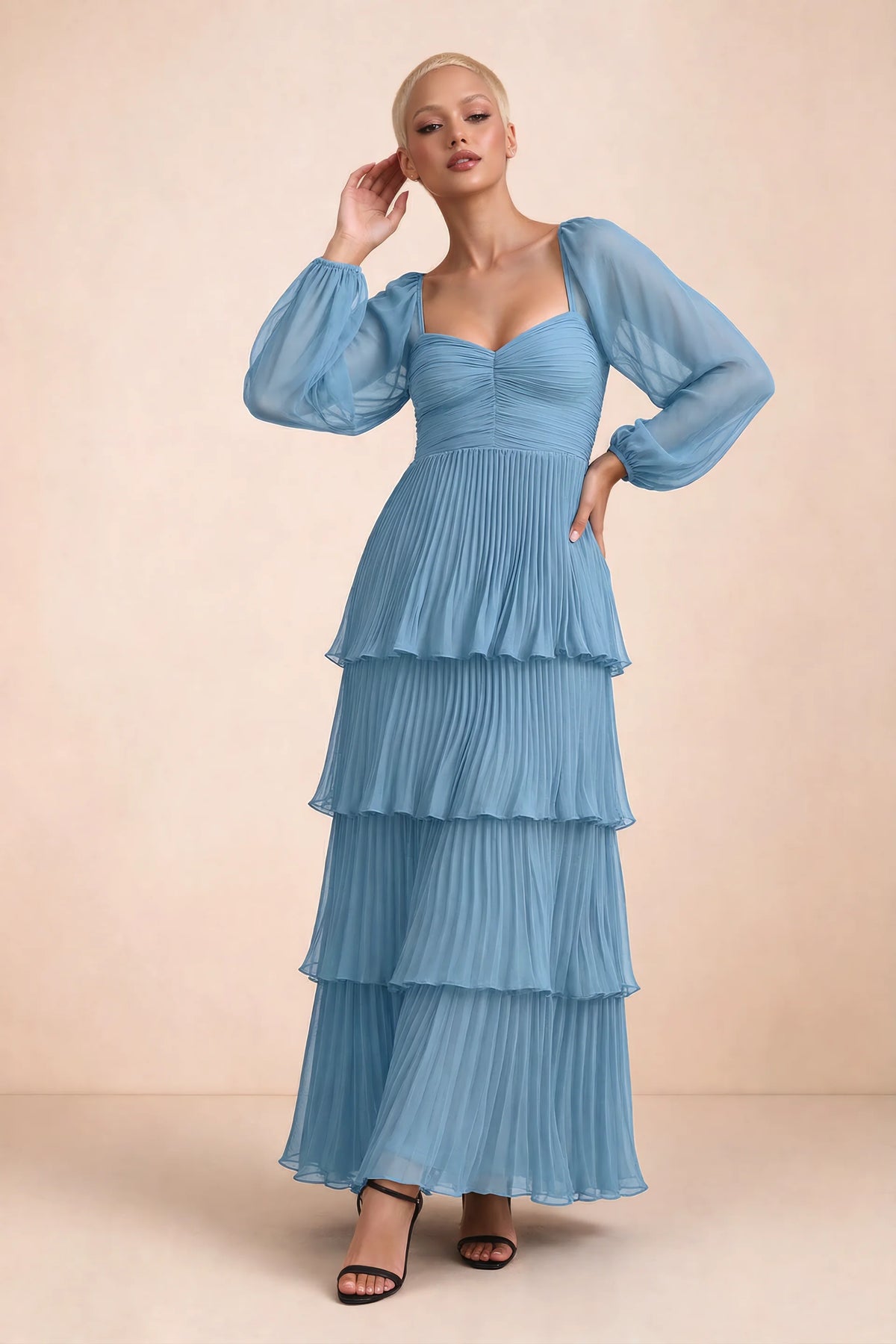Front studio view of Sienna steel blue tiered pleated maxi dress with a long flowing skirt