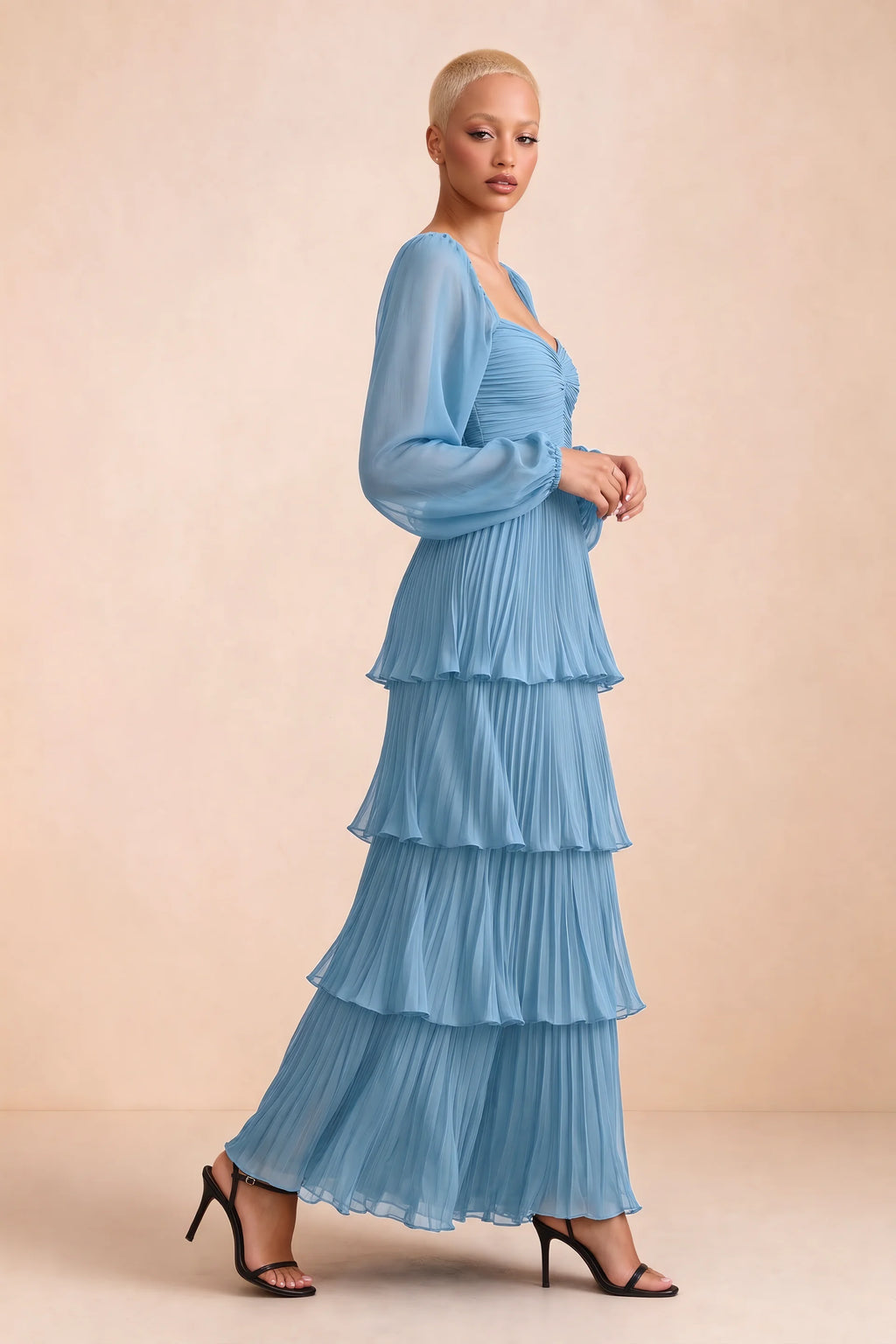 Alternate front studio view of Sienna steel blue tiered pleated maxi dress with a long flowing skirt