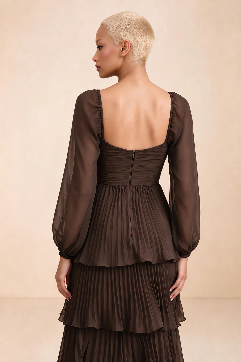 Close-up of low square back, sheer sleeves and centre-back zipper of Sienna truffle tiered pleated maxi dress