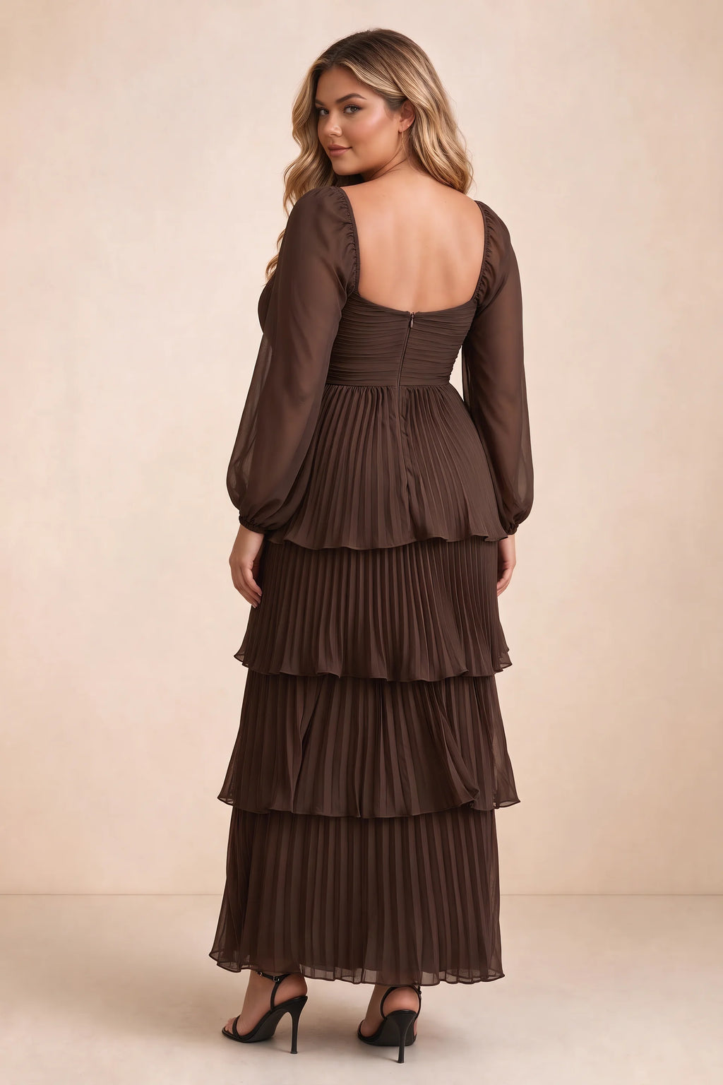 Rear view on a second model of Sienna truffle tiered pleated maxi dress with a long flowing skirt