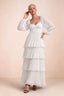 Front studio view of Sienna white tiered pleated maxi dress with a long flowing skirt
