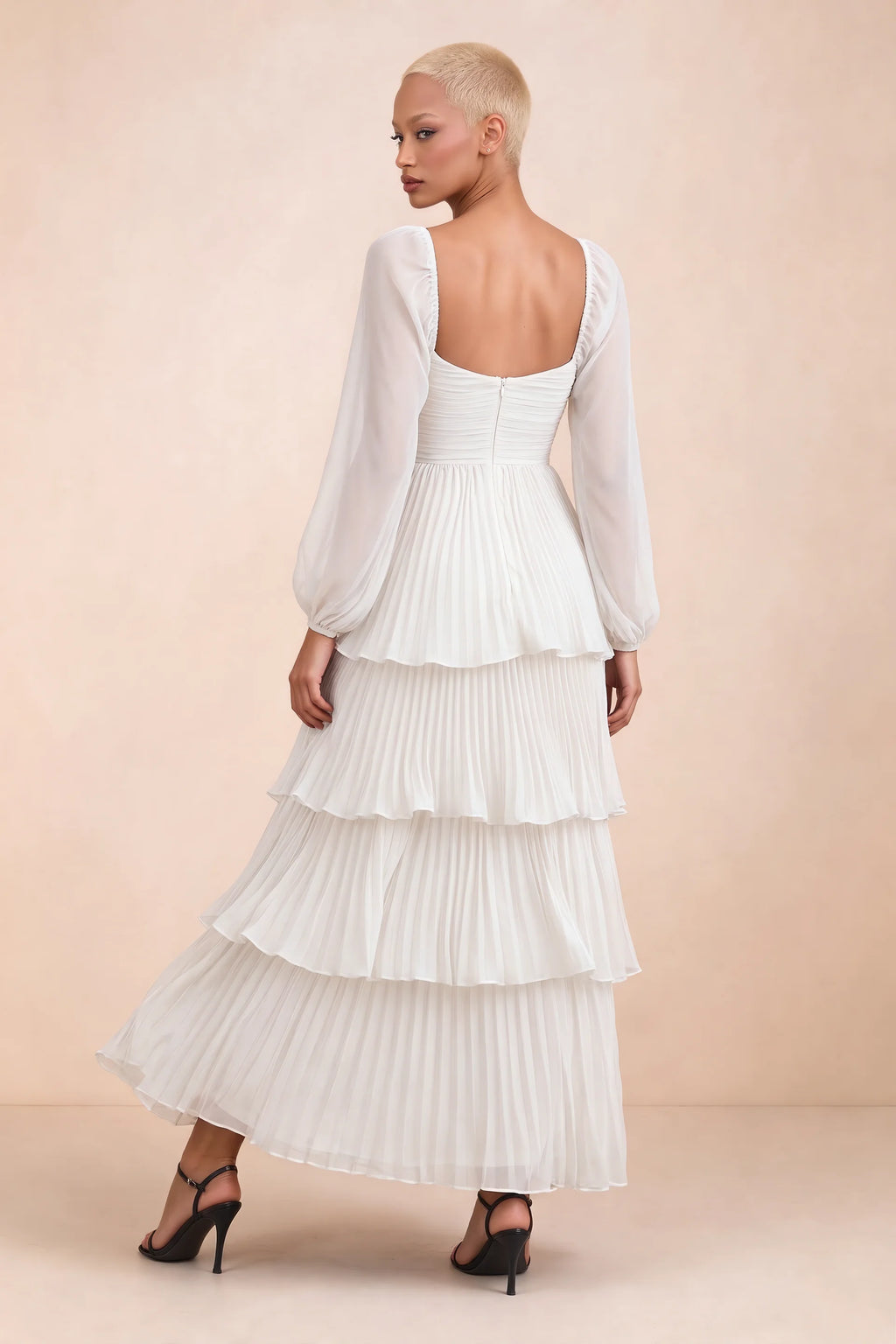 Rear studio view of Sienna white tiered pleated maxi dress with a long flowing skirt