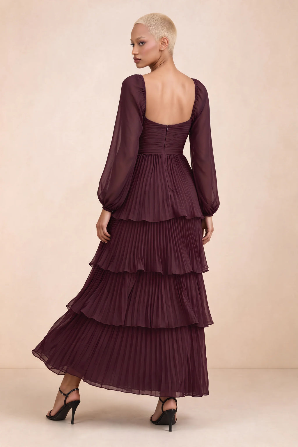 Rear studio view of Sienna wine tiered pleated maxi dress with a long flowing skirt