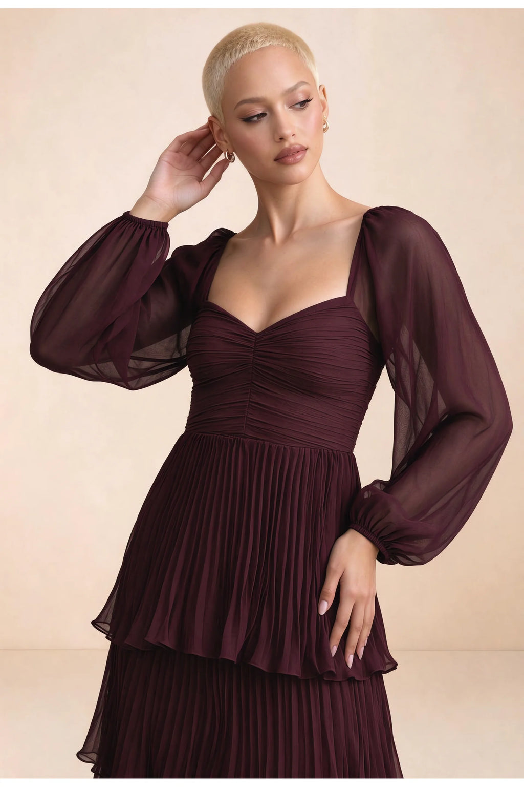 Close-up of sweetheart neckline, sheer sleeves and ruched waist of Sienna wine tiered pleated maxi dress