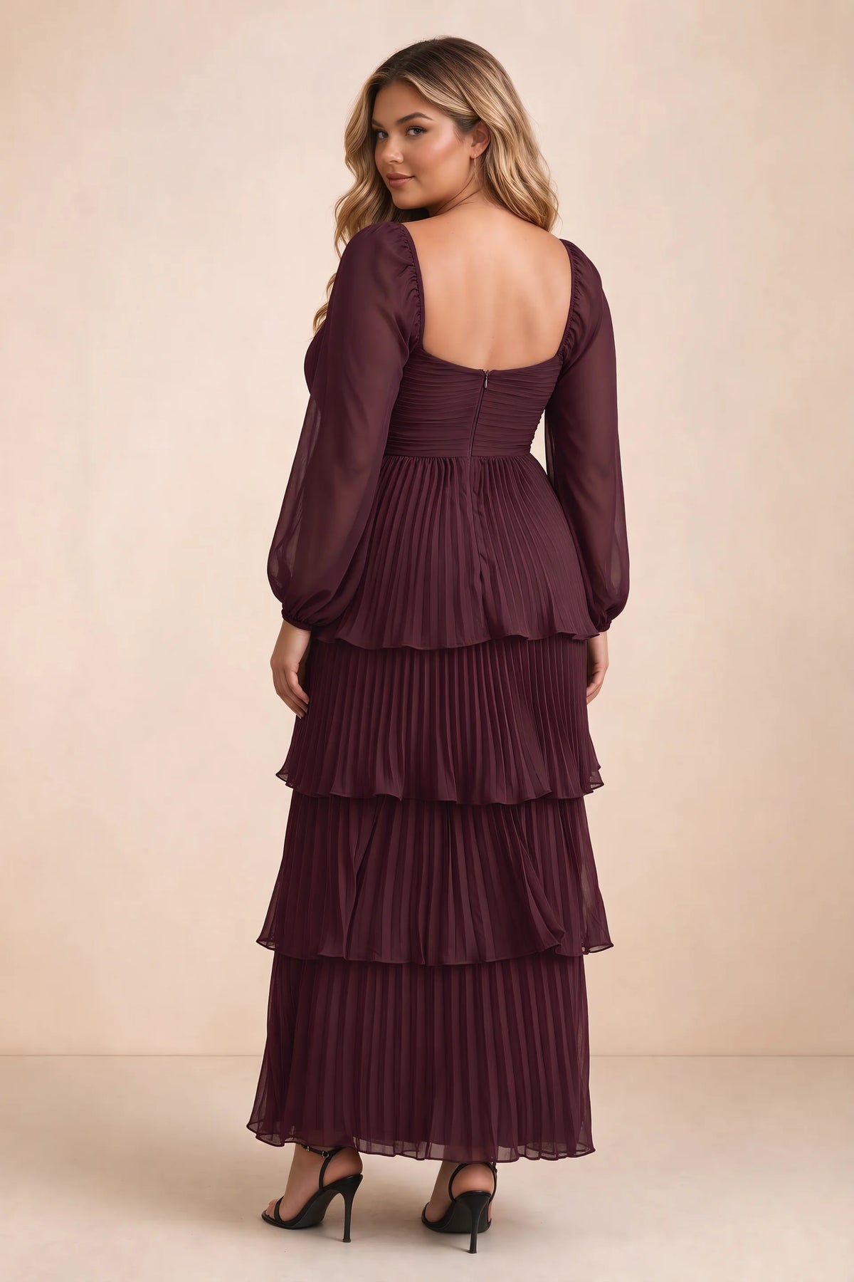 Rear view on a second model of Sienna wine tiered pleated maxi dress with a long flowing skirt