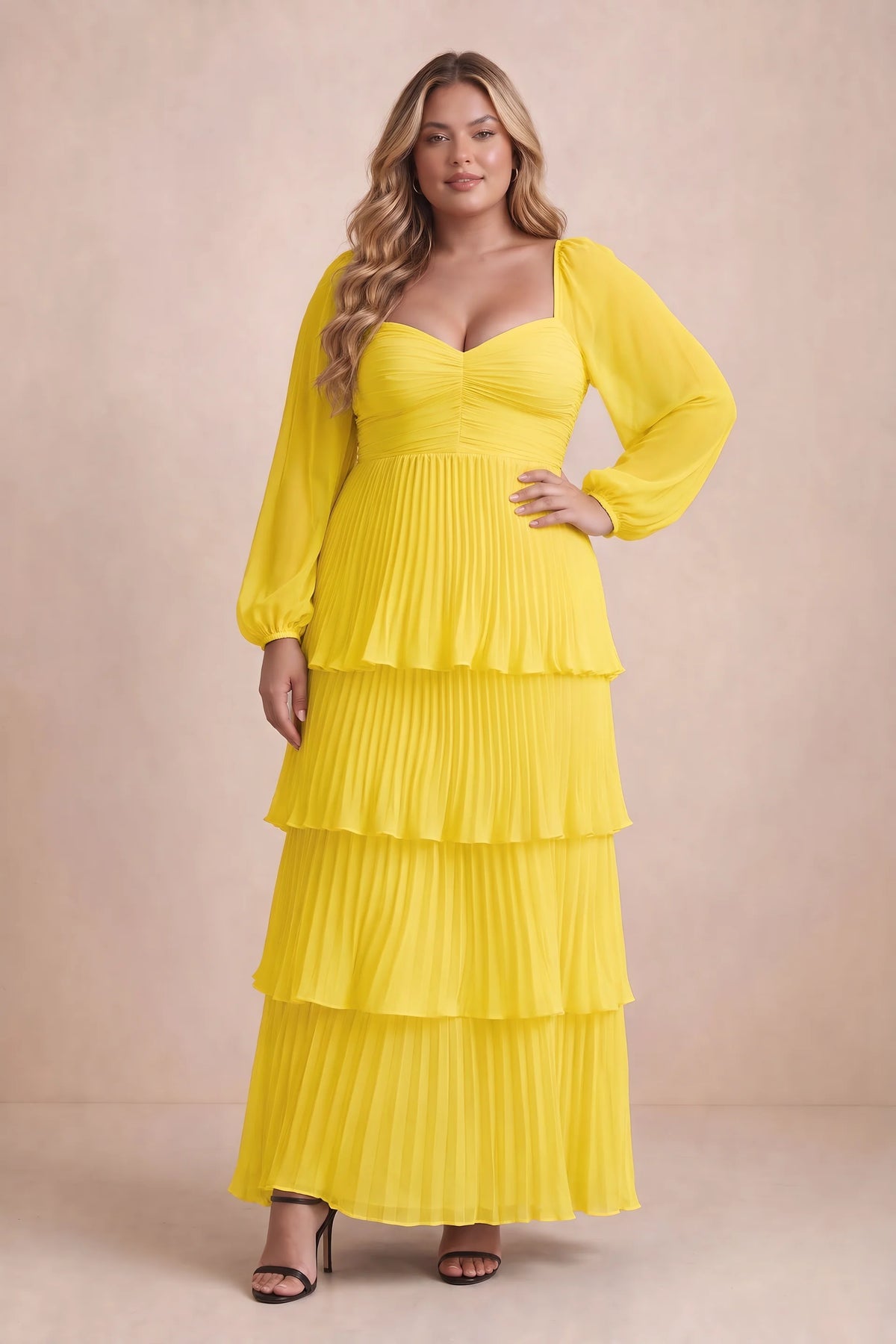 Front view on a second model of Sienna yellow tiered pleated maxi dress with a long flowing skirt