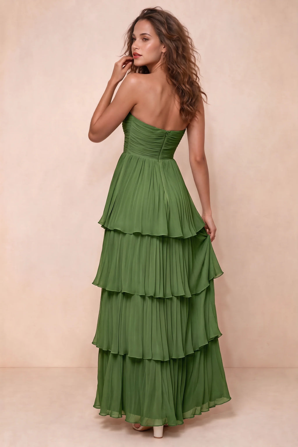 Rear studio view of Sonia basil tiered pleated maxi dress with a long flowing skirt