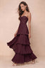 Front studio view of Sonia burgundy tiered pleated maxi dress with a long flowing skirt